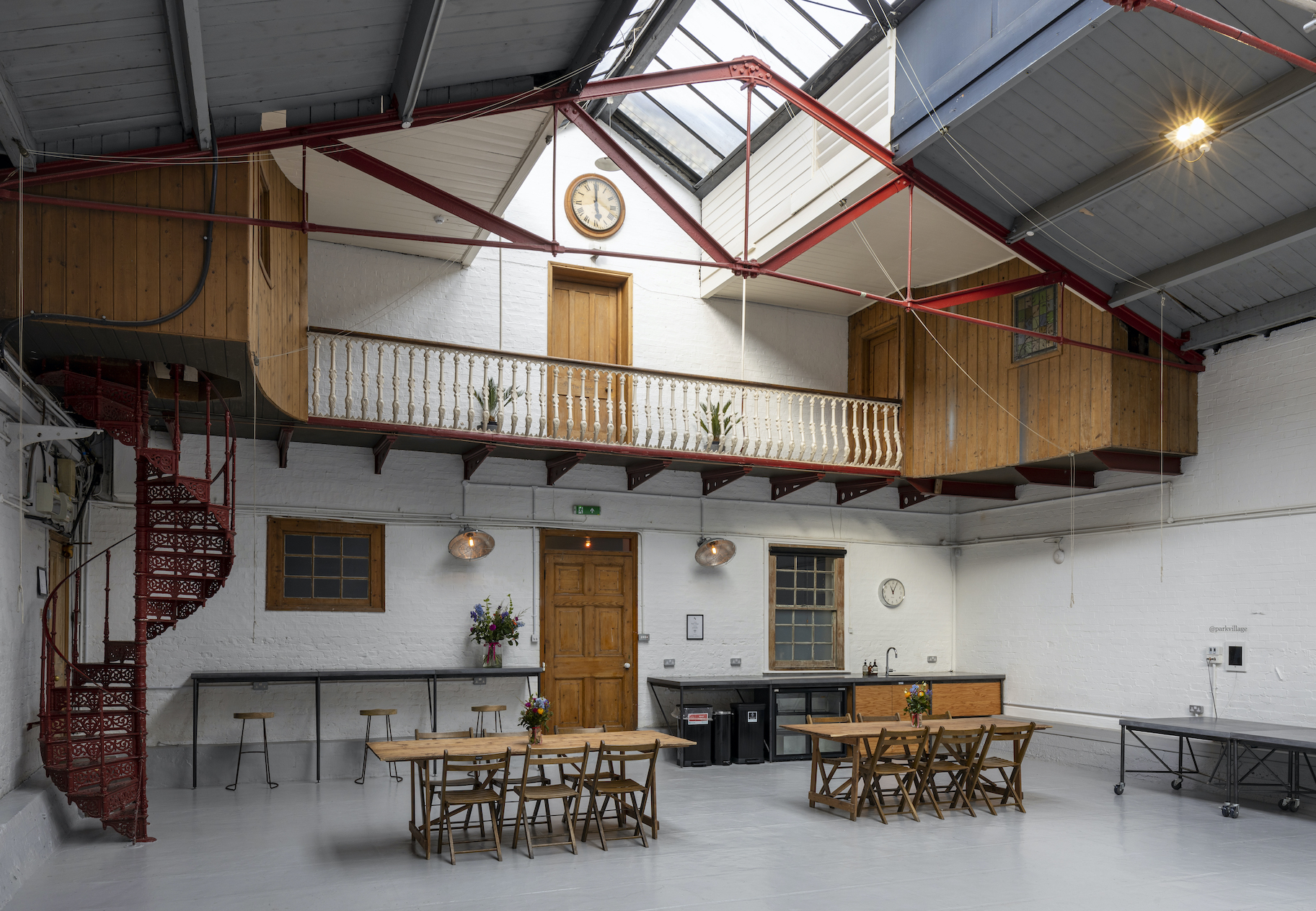 Versatile industrial-chic event space in Park Village for workshops and networking.