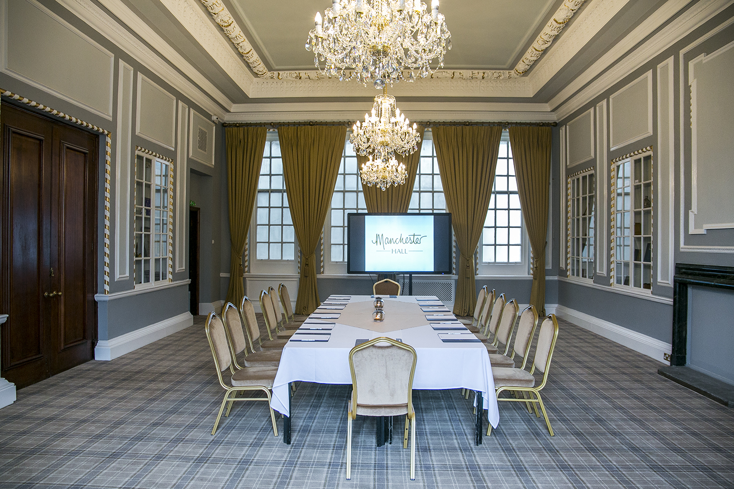 Sophisticated meeting room in Manchester Hall with elegant decor for corporate events.