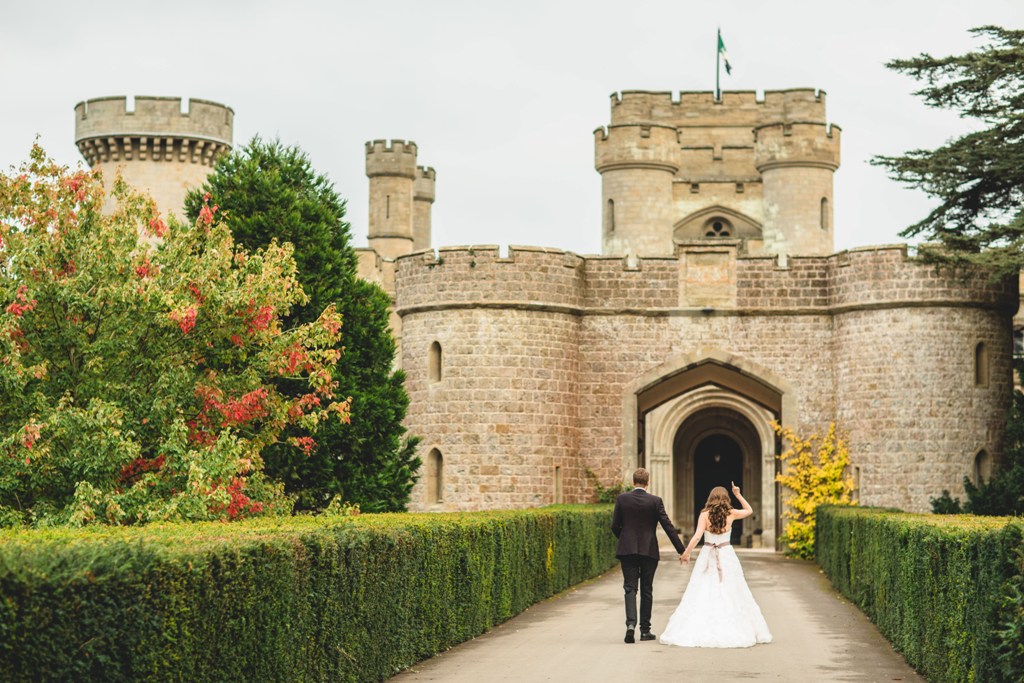 Eastnor Castle venue with lush greenery, ideal for romantic weddings and upscale events.