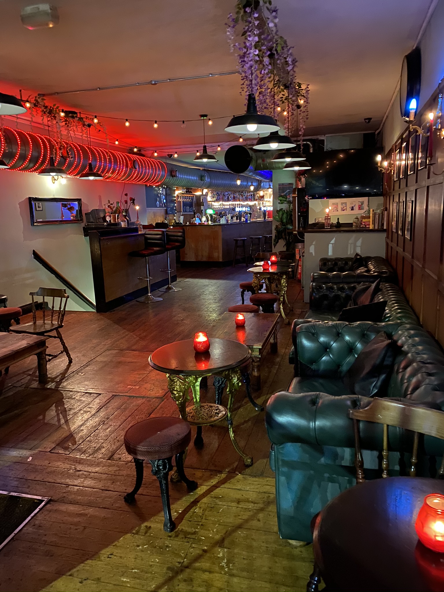 Stylish T-Bird Main Bar with cozy leather seating for networking events and gatherings.