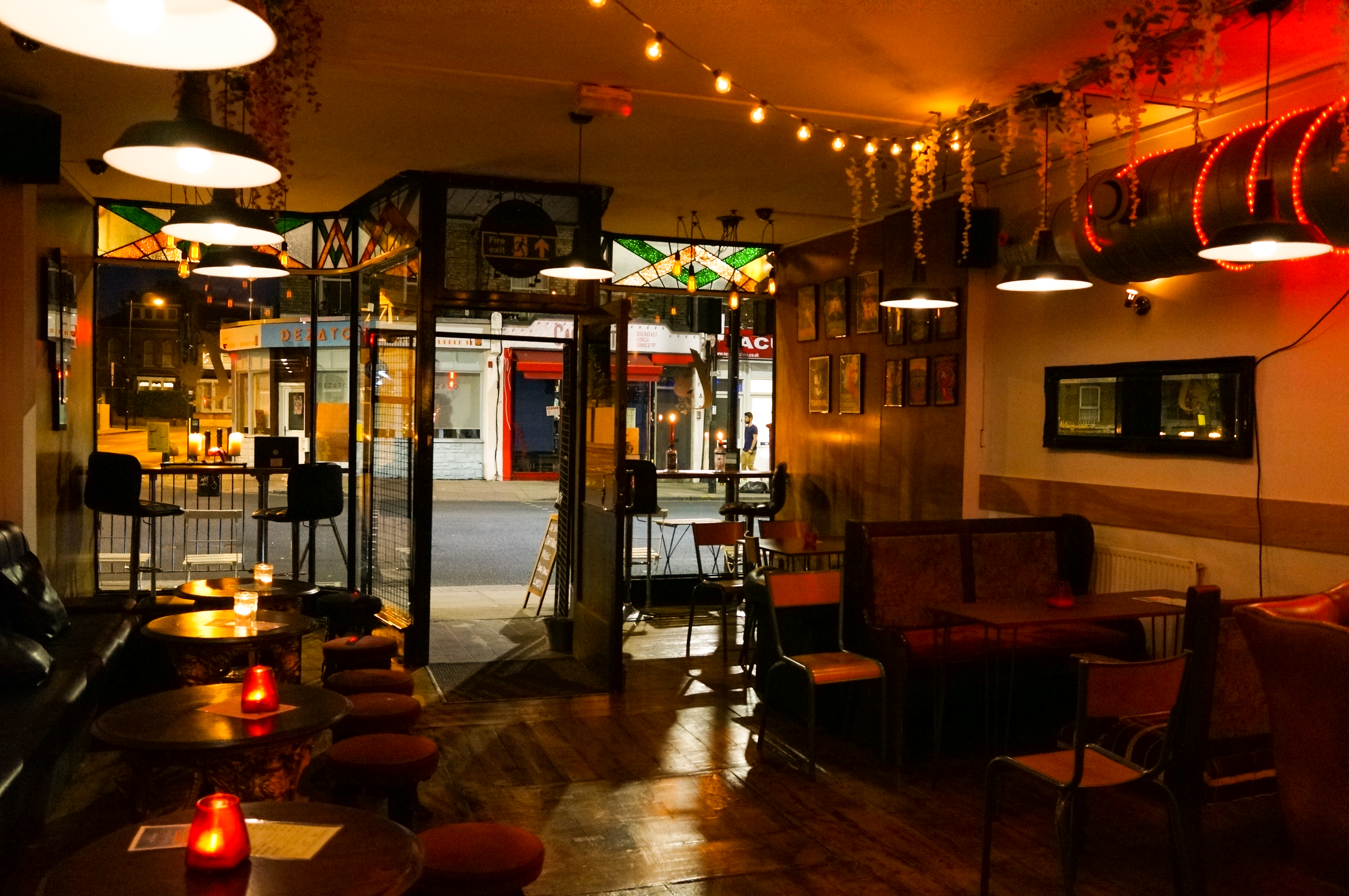 Cozy Main Bar in T-Bird with warm lighting, ideal for networking events and gatherings.