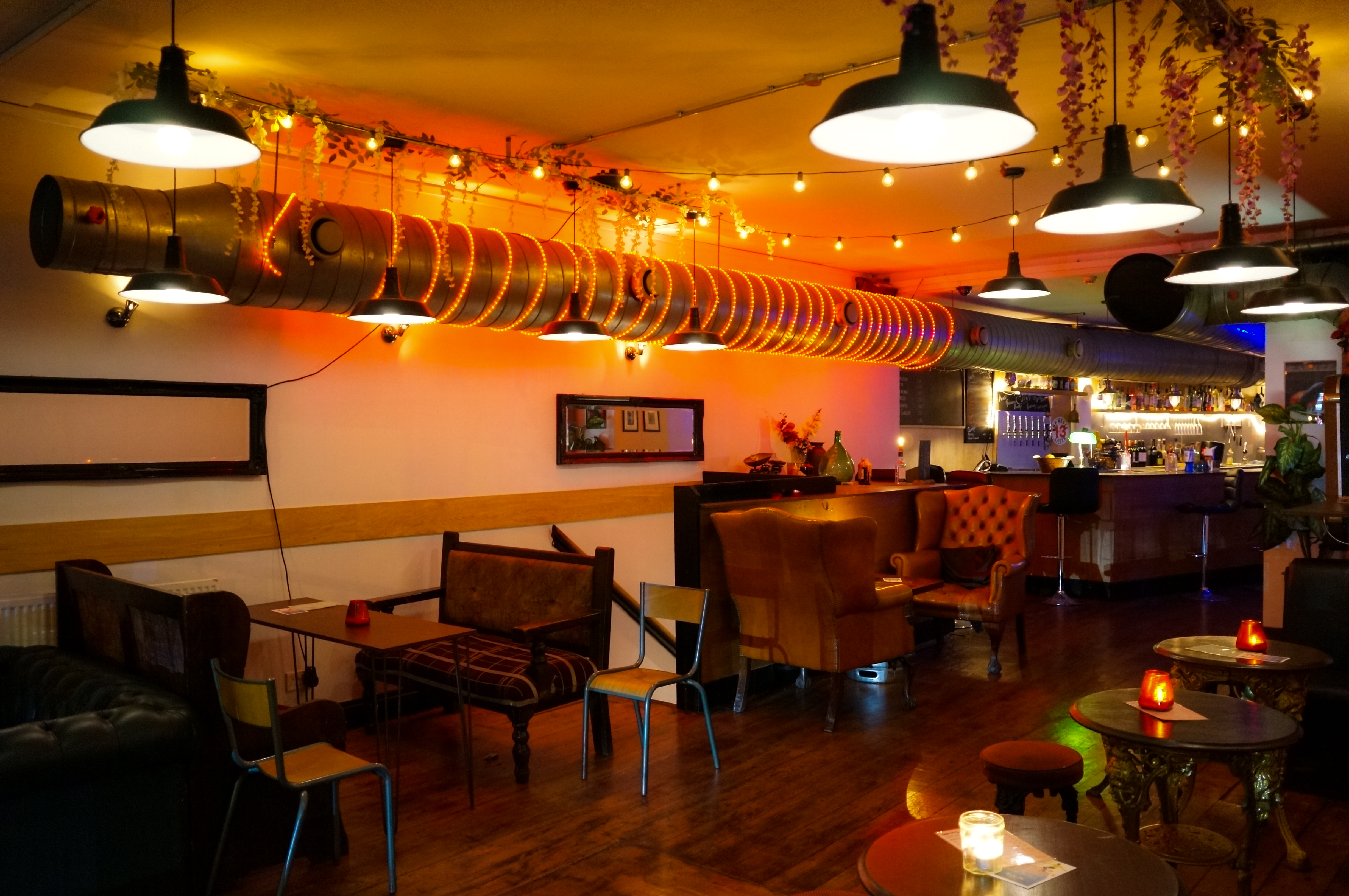 Stylish Main Bar in T-Bird with warm lighting, ideal for networking events and receptions.