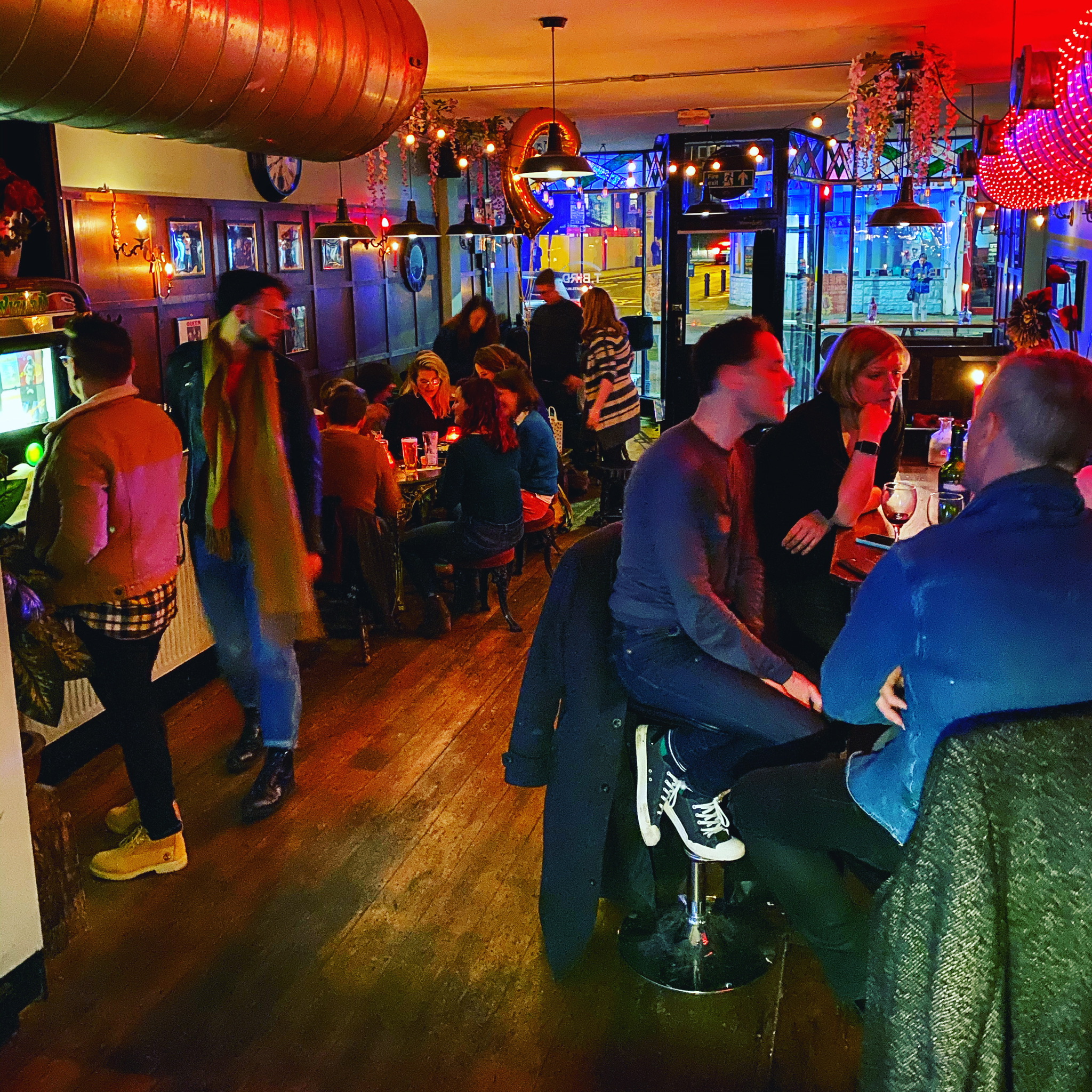 Vibrant Main Bar in T-Bird, cozy seating for networking events and social mixers.