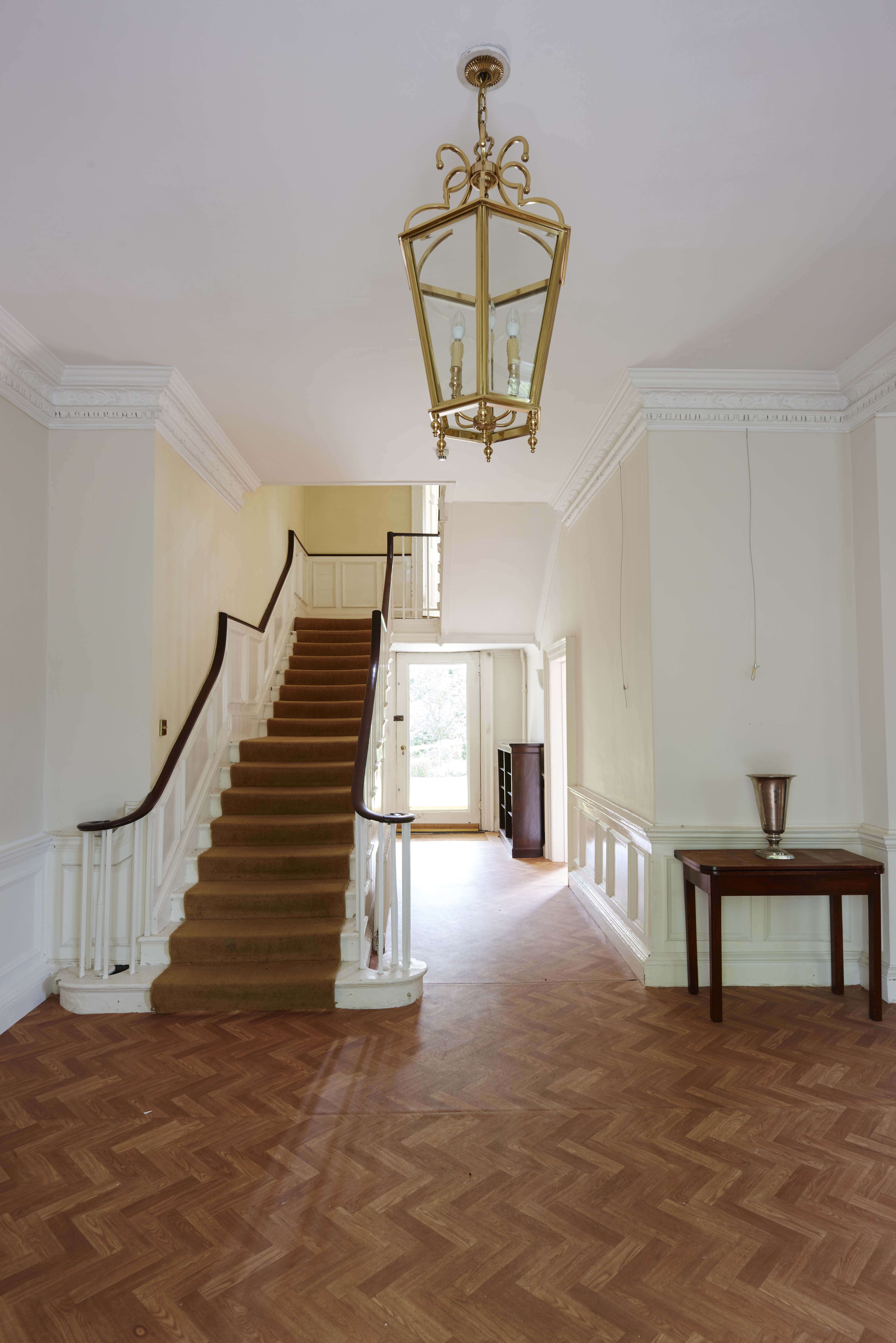 Lutyens' room at Bell House with elegant staircase, perfect for networking events.