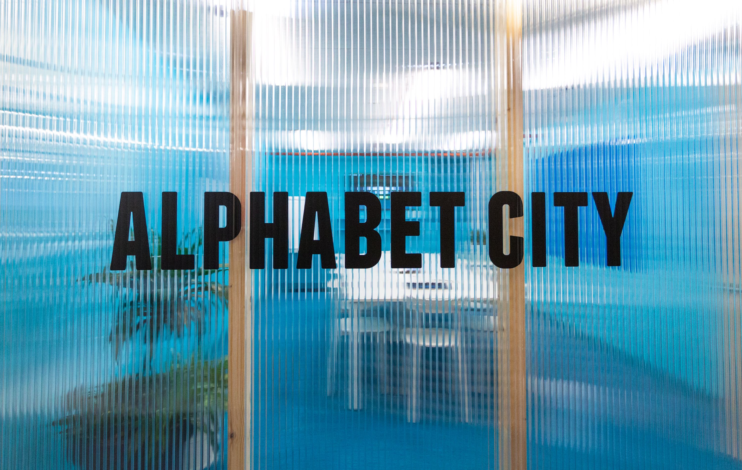 Modern Alphabet City Meeting Room with translucent walls for creative brainstorming sessions.