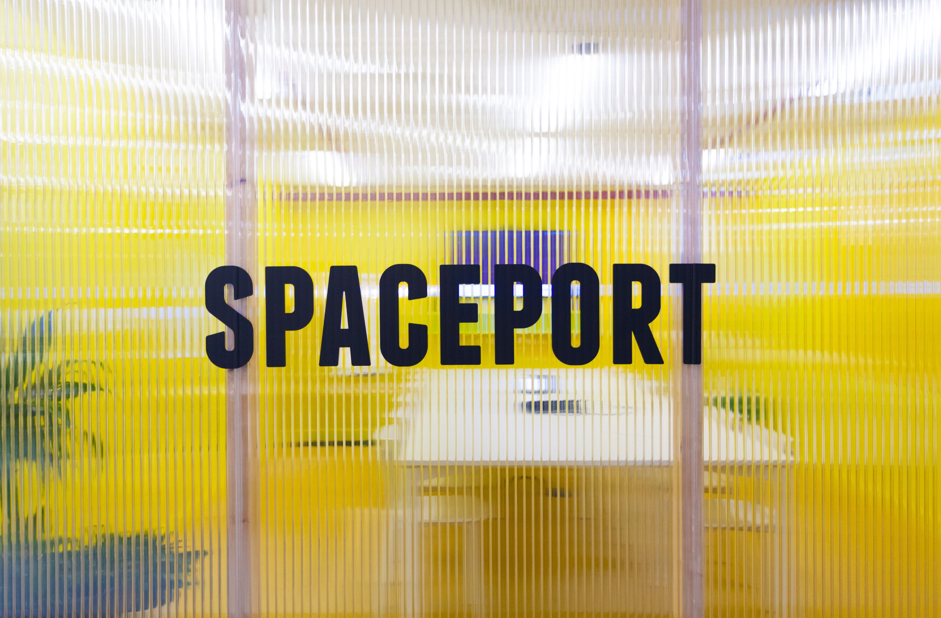 Bright yellow Spaceport Meeting Room at Huckletree West for creative brainstorming events.