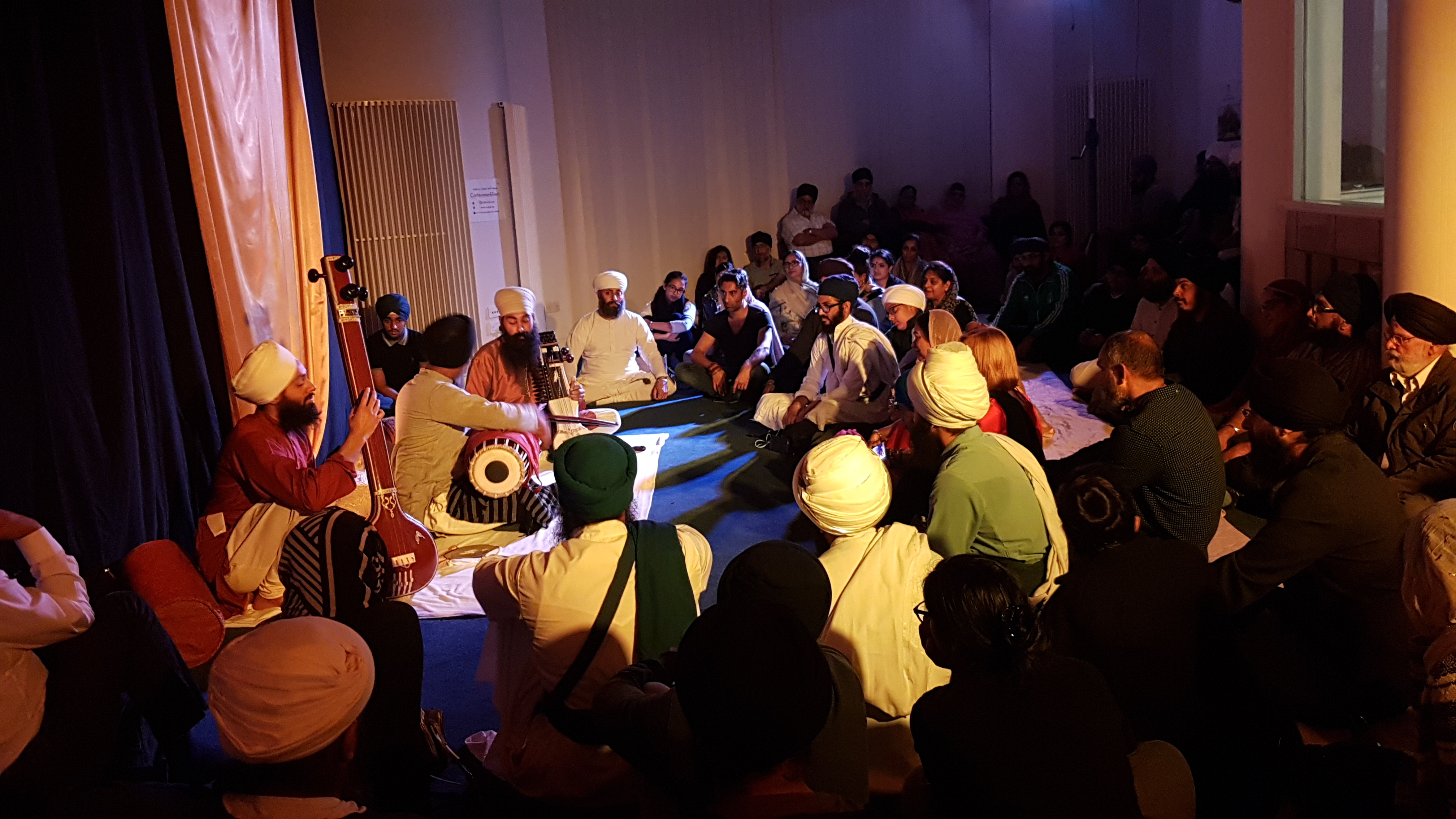 Vibrant seminar room at Nishkam Centre for cultural workshops and community events.