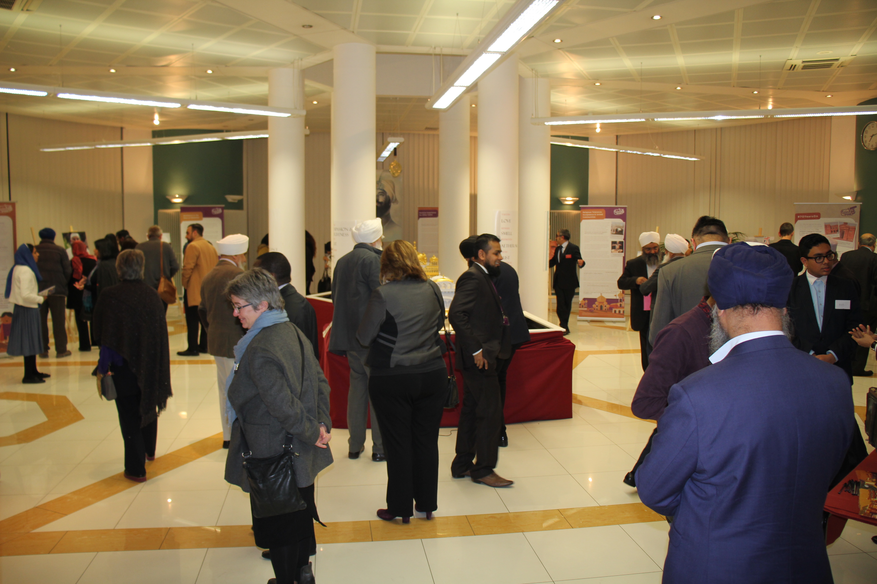 "Exhibition Centre at Nishkam Centre bustling with attendees during a conference event."