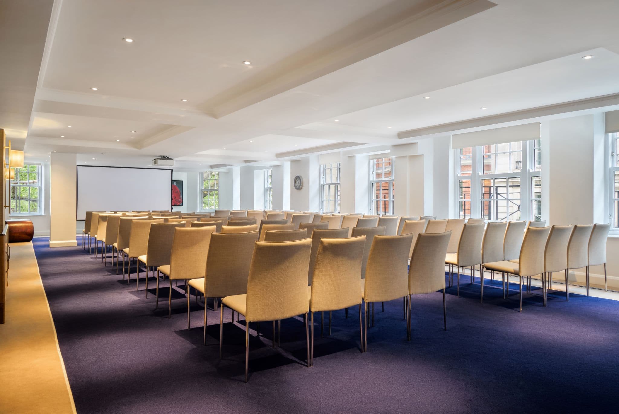 Theater-style meeting room setup in The May Fair Hotel for corporate events and presentations.