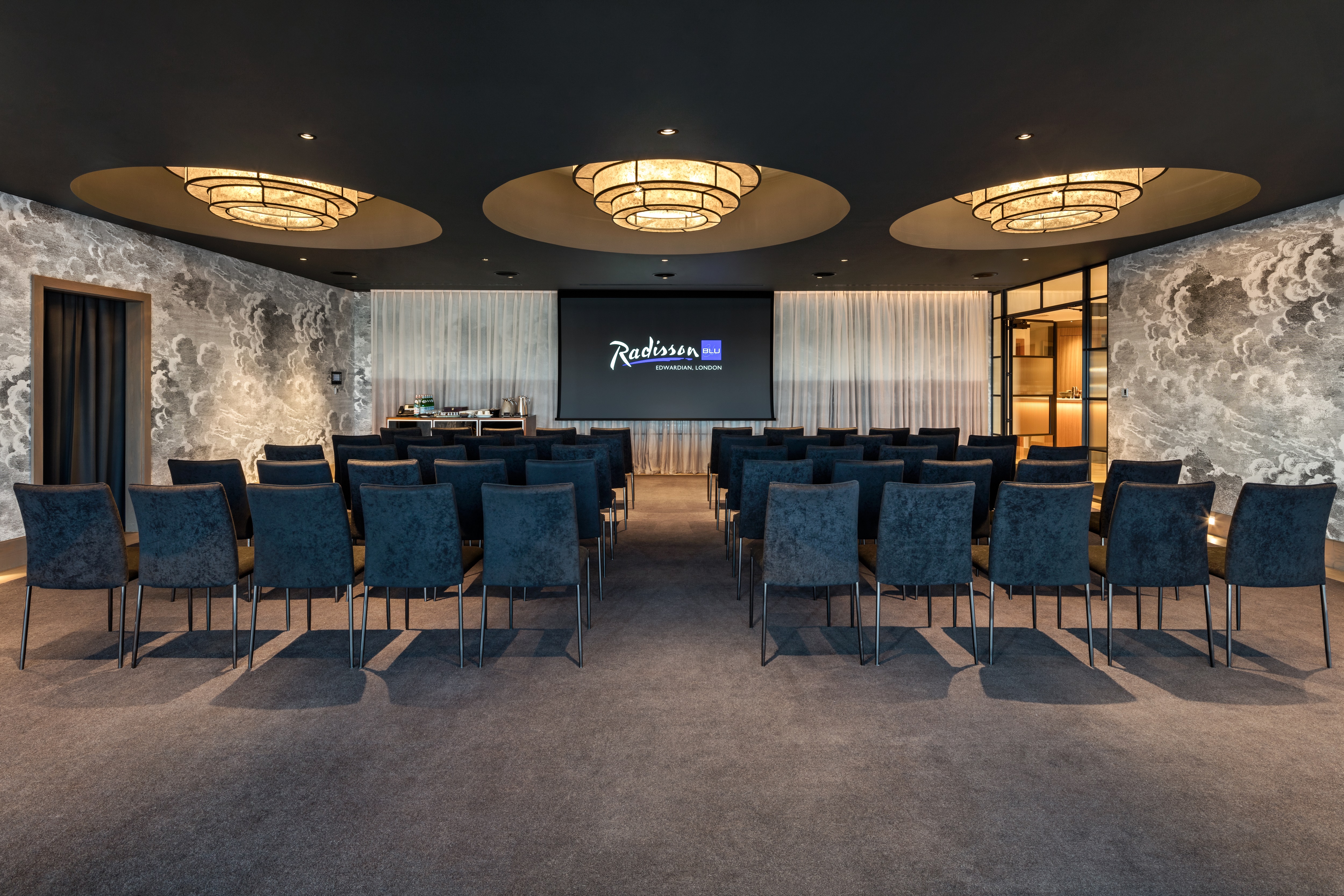 Penthouse Suite conference room at Radisson Blu, London - modern setup for meetings.