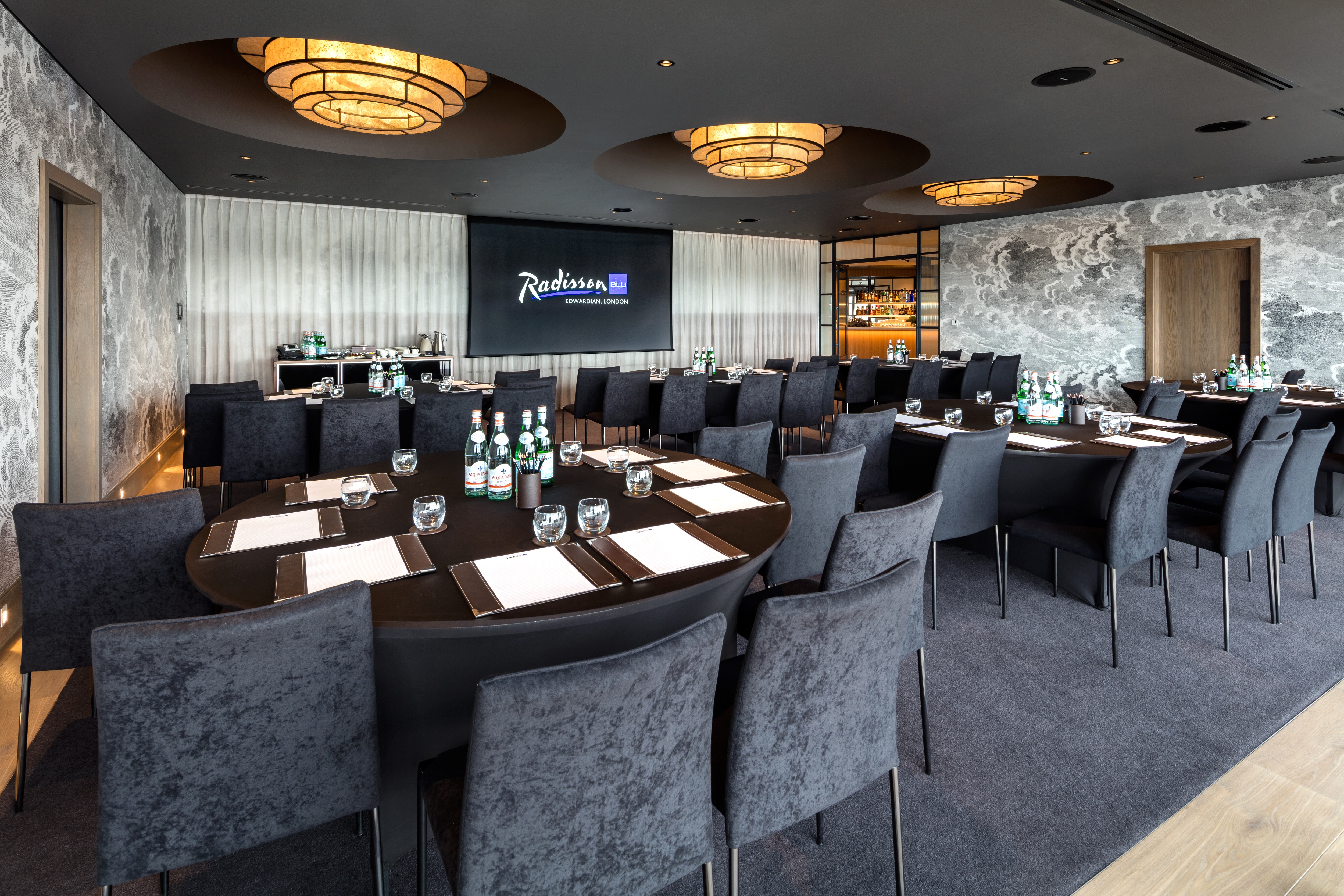 Penthouse Suite meeting room at Radisson Blu, London; elegant setup for corporate events.