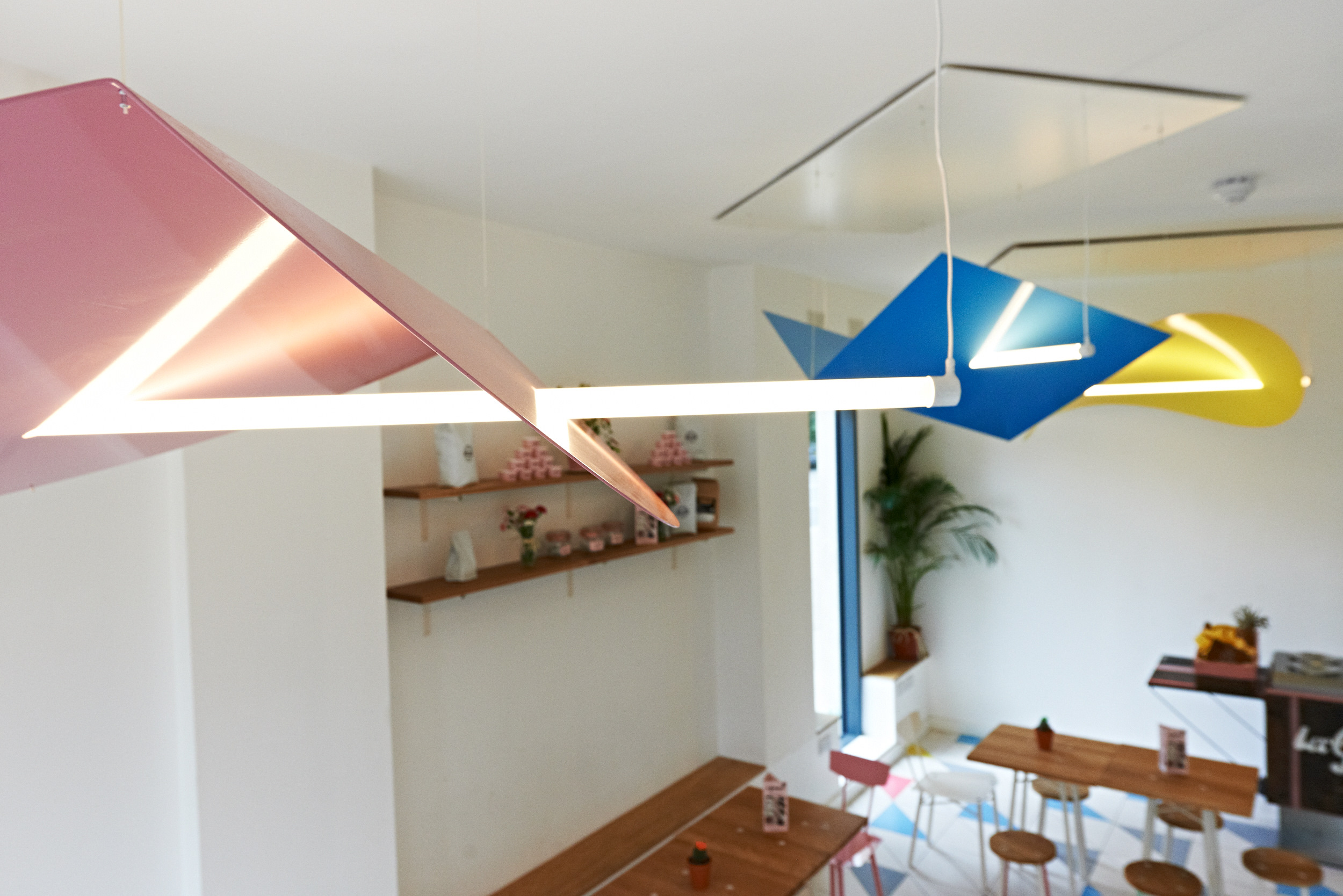 Modern gelato cafe with colorful lighting, perfect for networking events and gatherings.