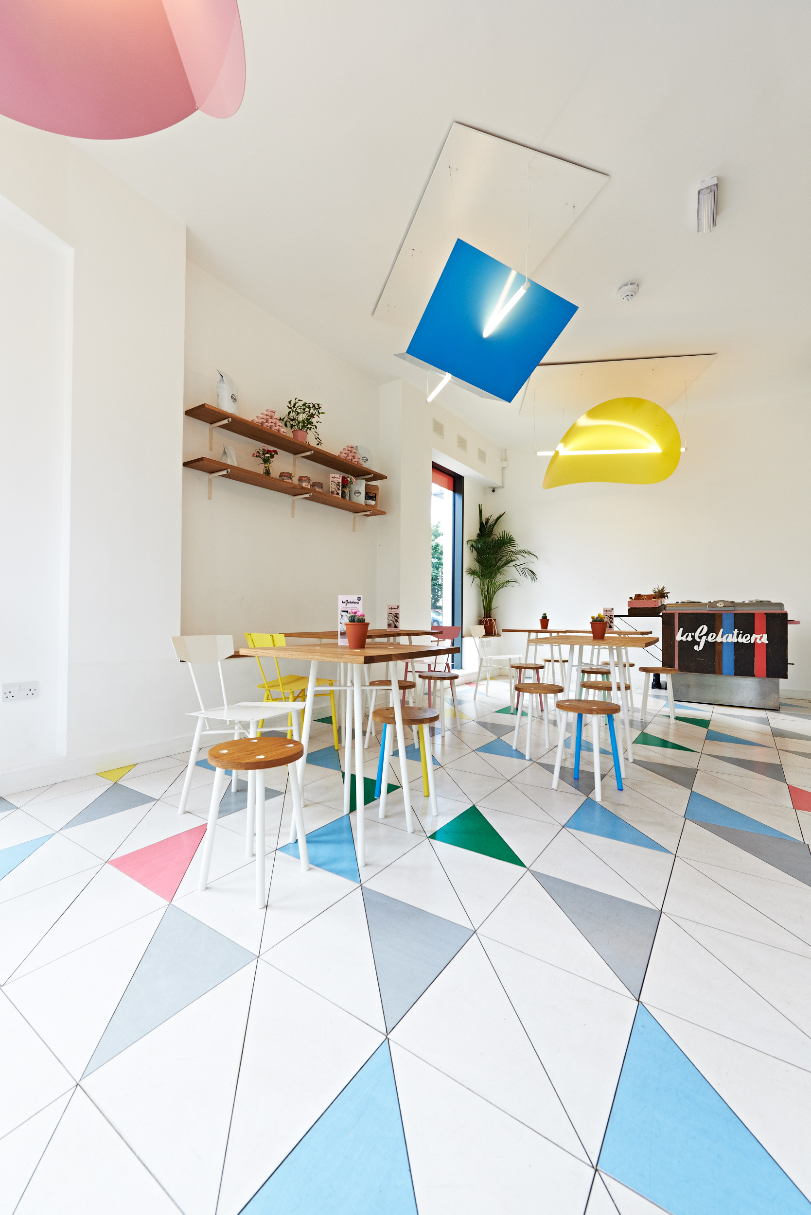 Vibrant gelato cafe with colorful tiles, ideal for casual meetings and networking events.