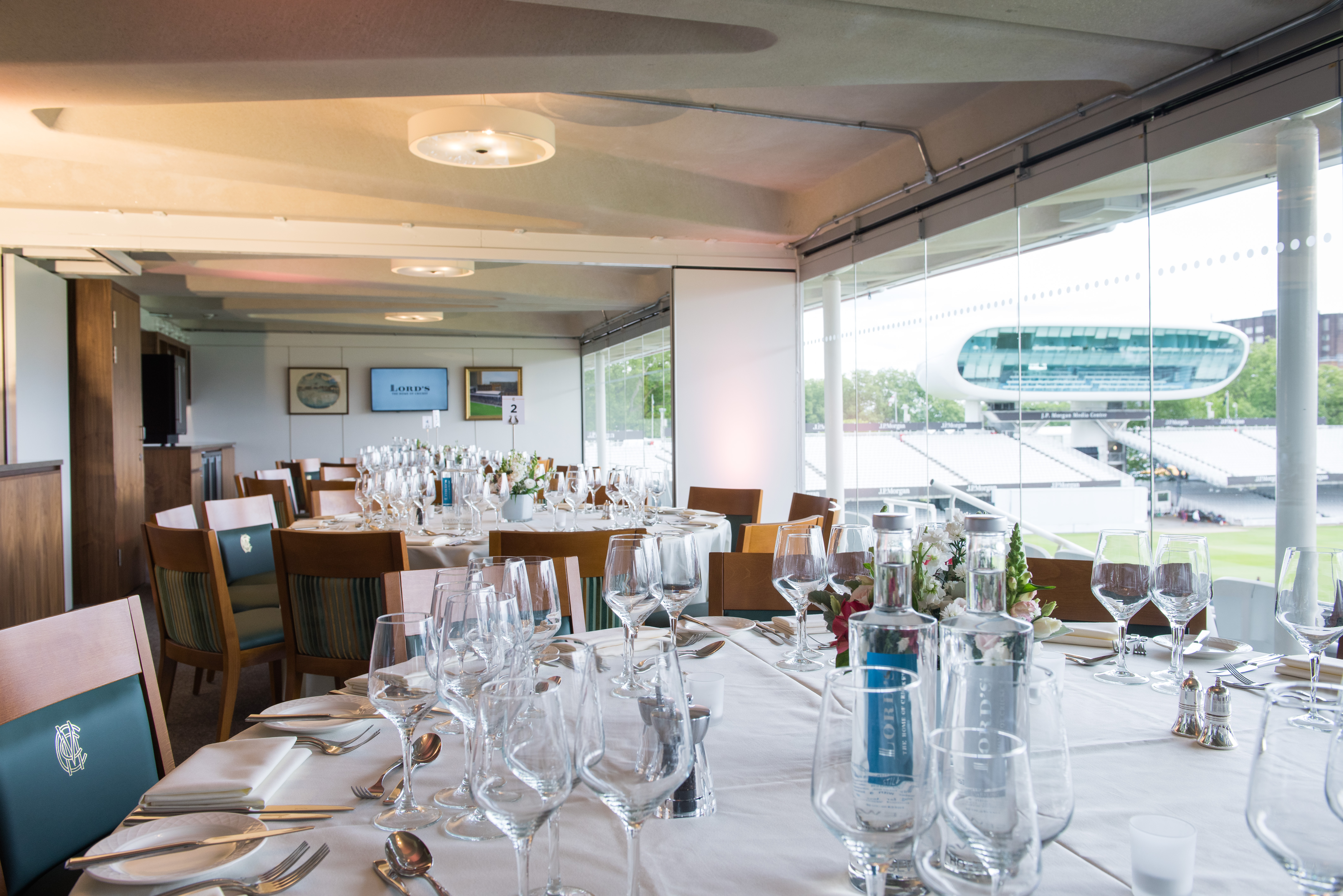 Elegant dining setup in The President's Box at Lord's Cricket Ground for corporate events.
