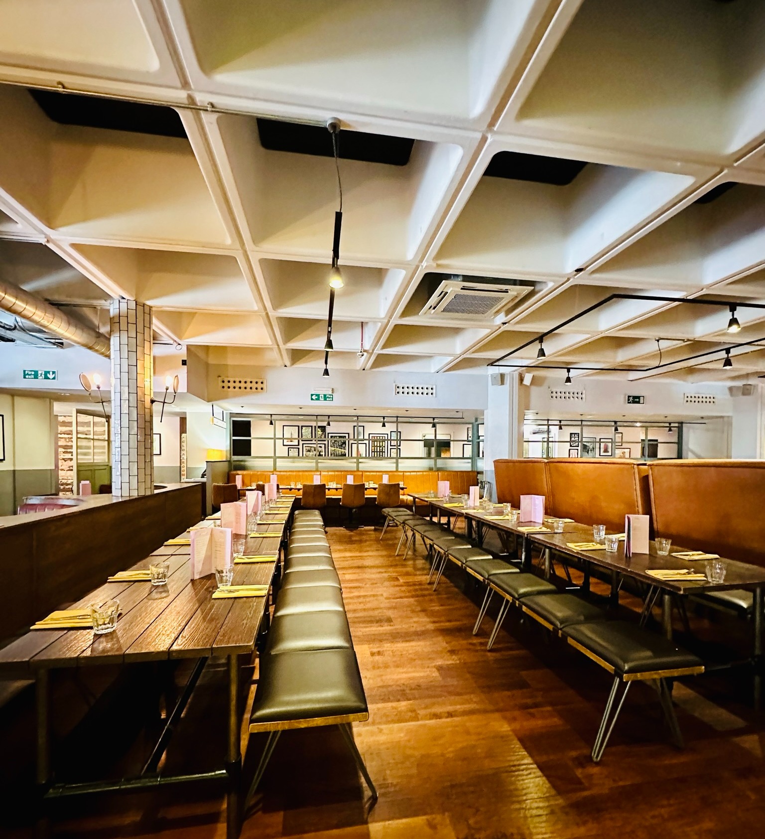 Spacious All Star Lanes venue with long tables for events and gatherings.