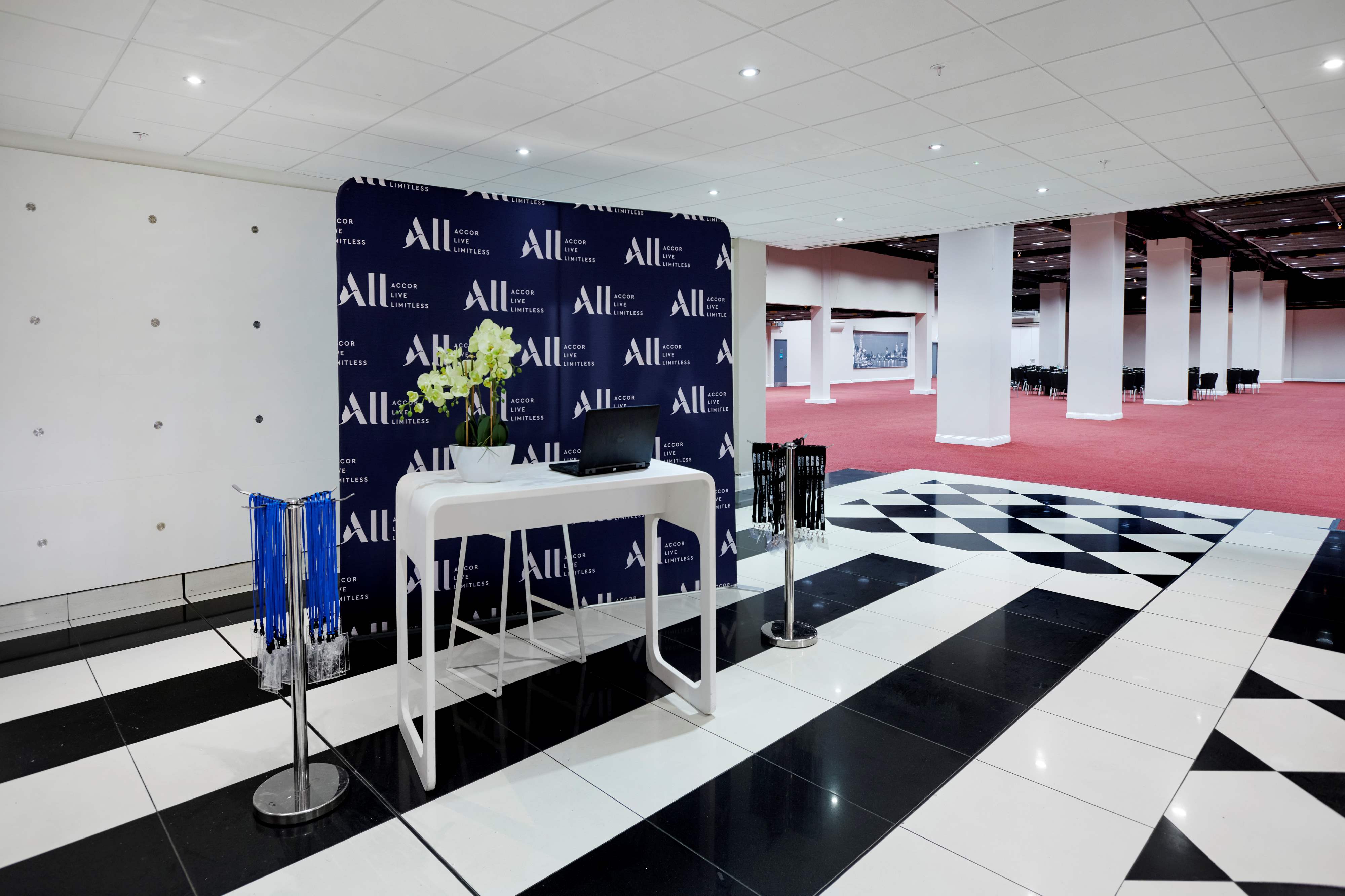 Chablis Suite registration area with elegant decor for professional events in London.