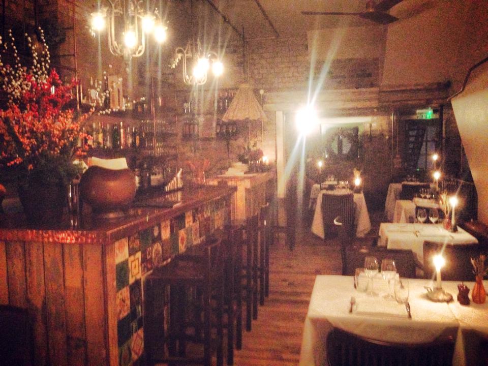 Cozy restaurant venue with warm lighting, ideal for private events and gatherings.