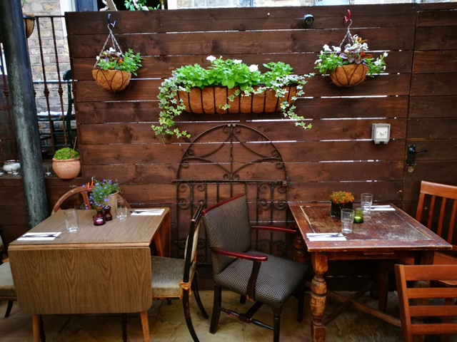 Intimate dining space at Rullo's with rustic decor, ideal for casual meetings and networking.