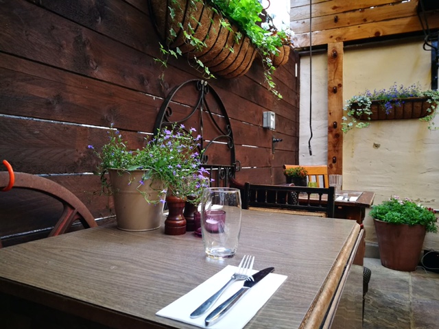 Charming outdoor dining space at Rullo's, perfect for intimate gatherings and events.