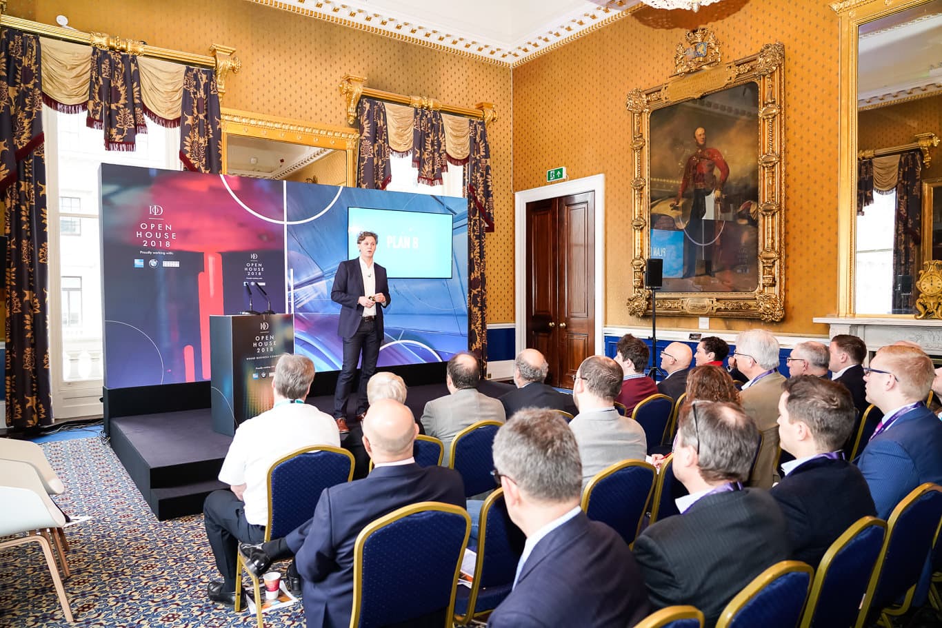 Speaker engaging audience at formal event in Waterloo, 116 Pall Mall venue.