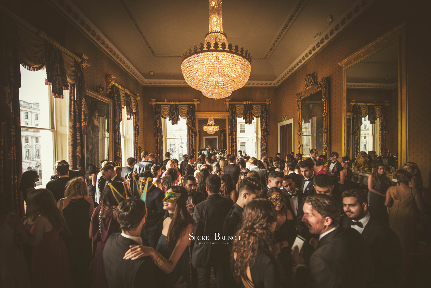 Elegant gala at Waterloo, 116 Pall Mall, featuring a grand chandelier and vibrant networking.
