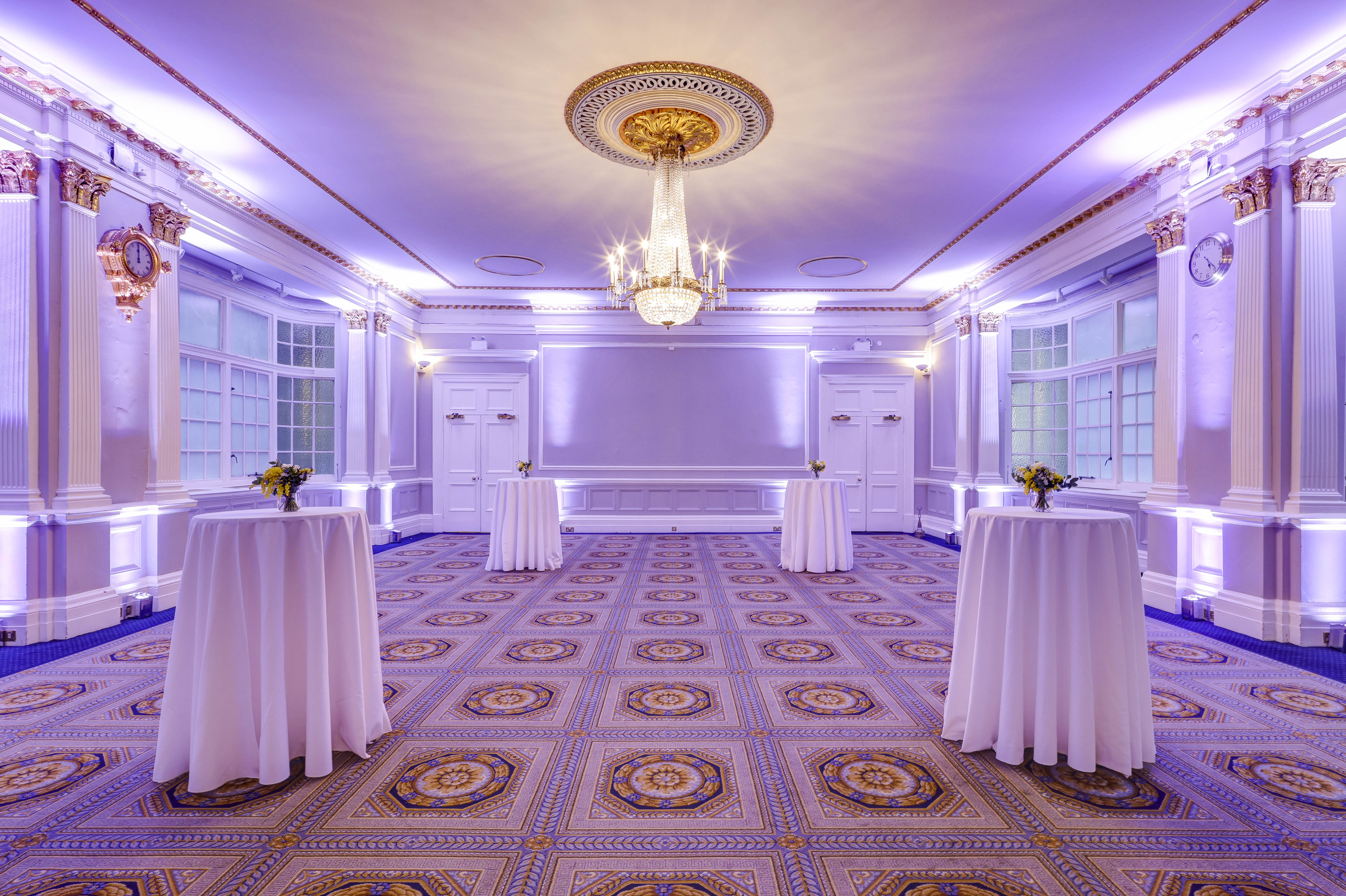 Elegant event space at Burton, 116 Pall Mall, with purple lighting for networking receptions.