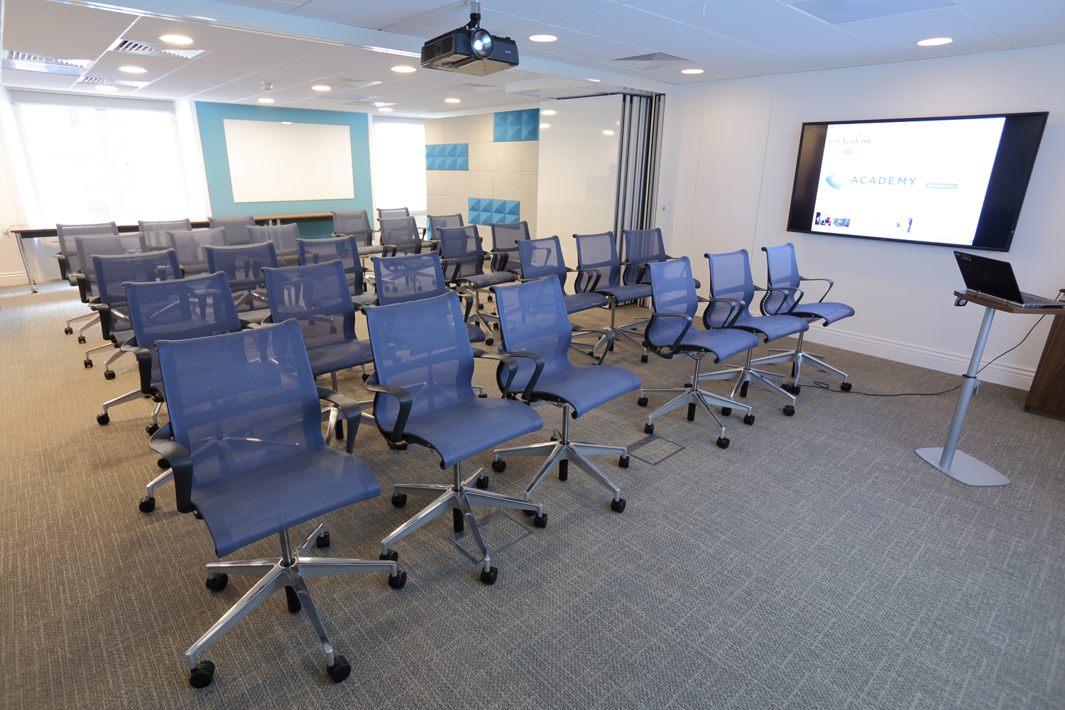 Modern meeting room at IoD Academy, ergonomic chairs for presentations and training.