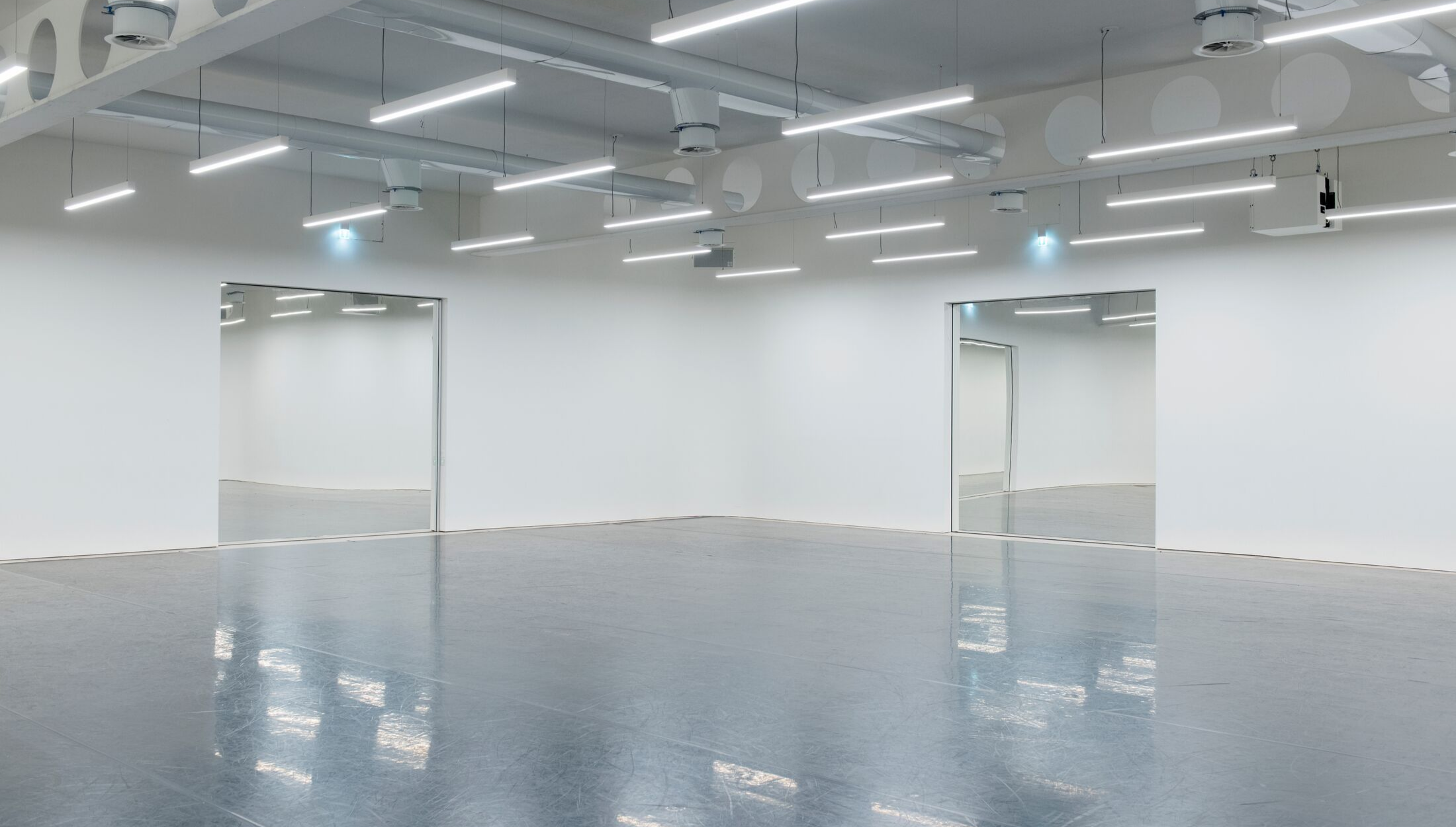 Versatile event space in Studio Wayne McGregor with polished floor and natural light.