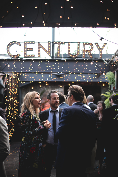 Rooftop Terrace networking event with retractable glass roof and twinkling lights.