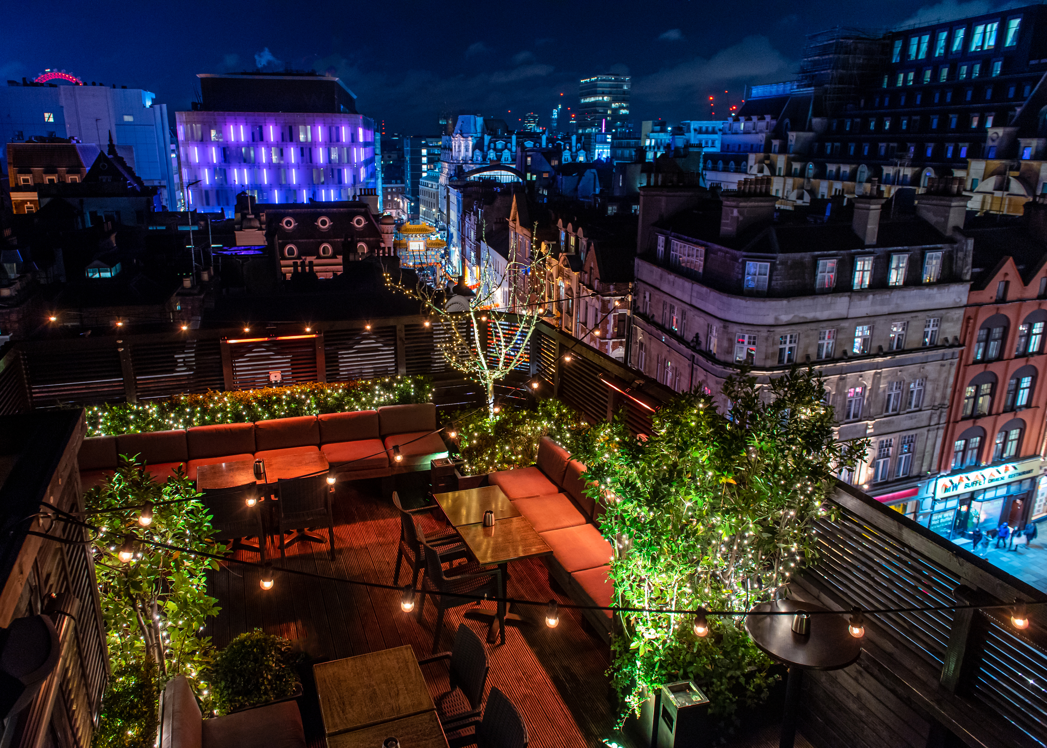 Rooftop Terrace with retractable glass roof, ideal for evening events and gatherings.