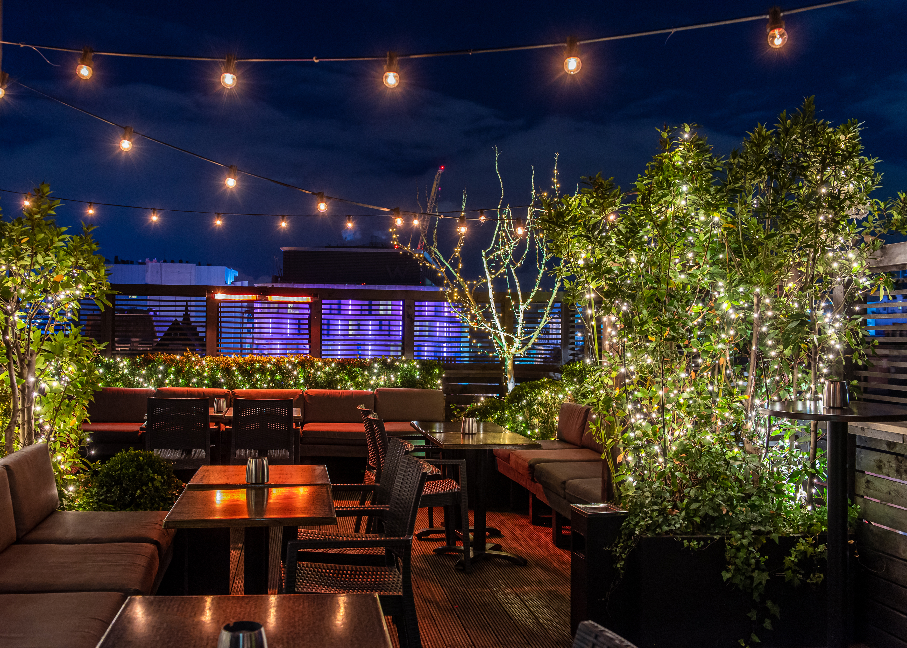 Rooftop Terrace with retractable glass roof, ideal for evening social and corporate events.