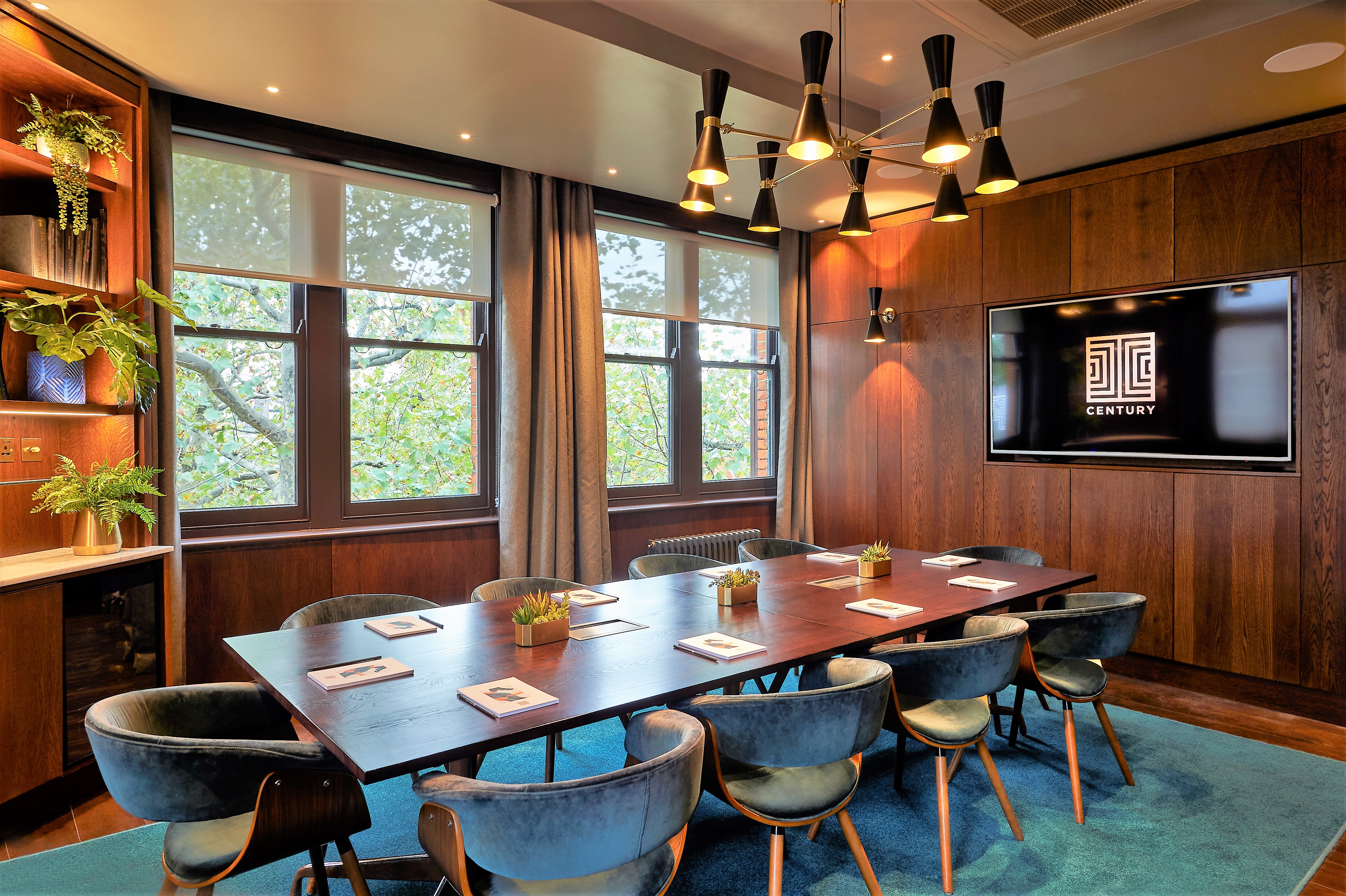 Modern meeting room at The Compton, featuring sleek wooden walls for creative collaboration.