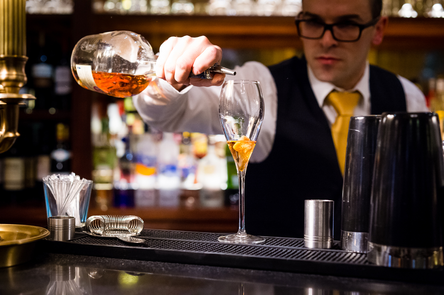 Bartender crafting a cocktail in Carlton Room, 116 Pall Mall for upscale events.