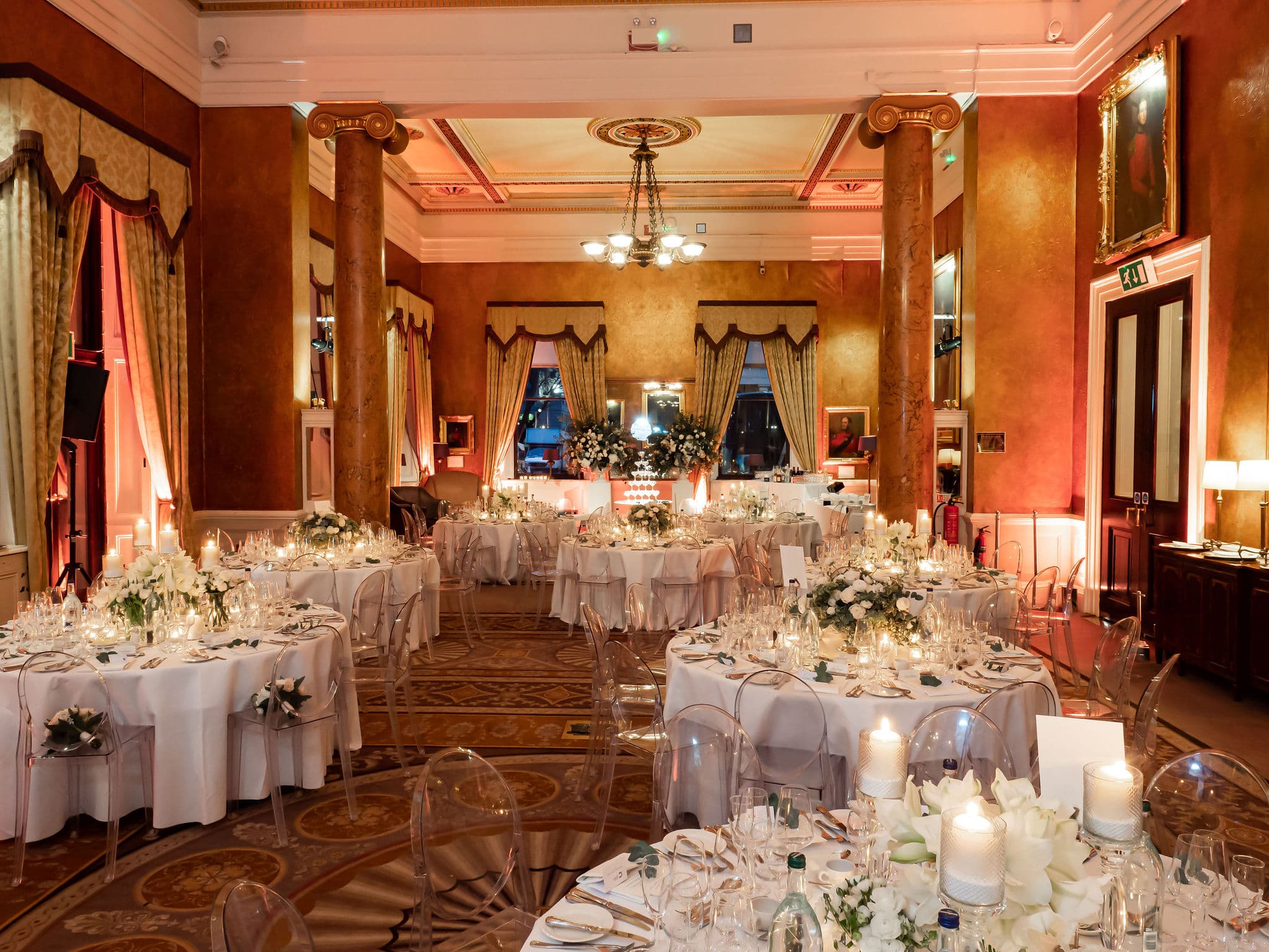 Elegant Carlton Room banquet hall with floral centerpieces, ideal for weddings and corporate events.