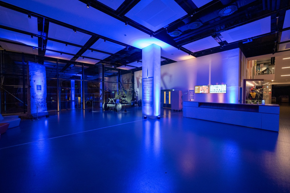 Modern event space in National Army Museum with blue lighting, ideal for corporate gatherings.