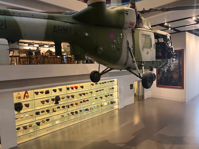 Atrium at National Army Museum with suspended helicopter, perfect for corporate events and exhibitions.