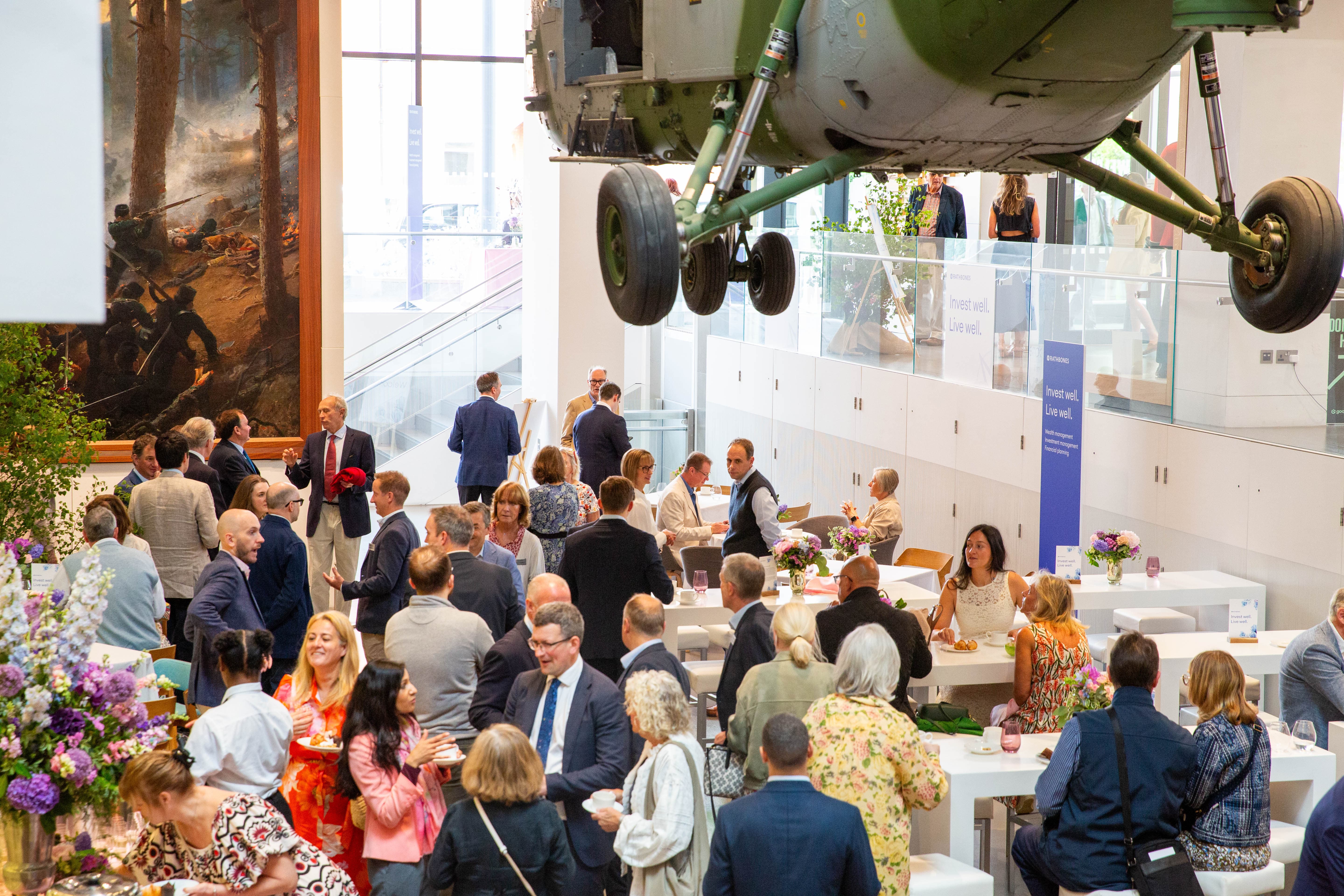 Corporate reception at National Army Museum atrium with dramatic ceiling installation.