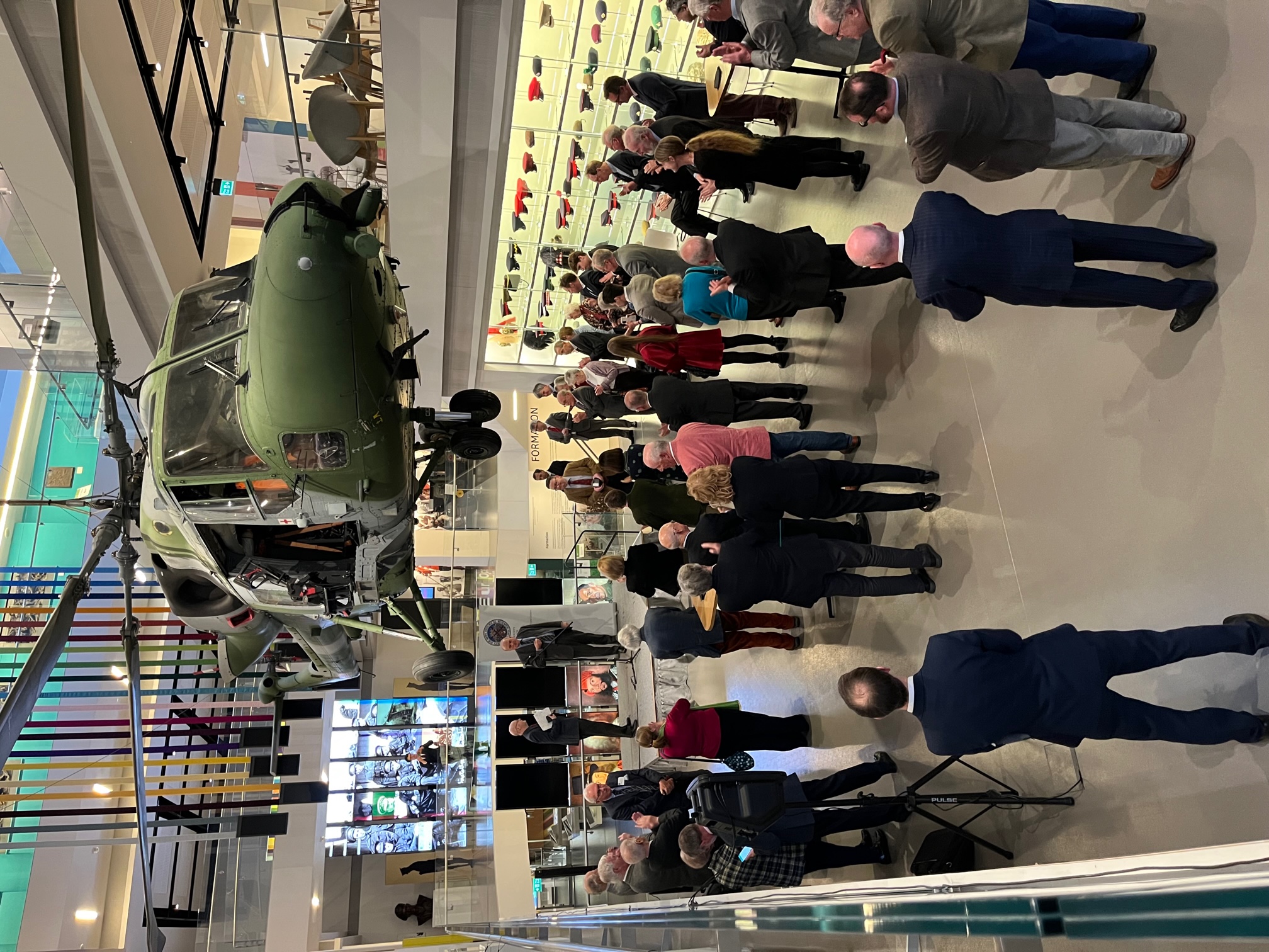 Atrium at National Army Museum with suspended aircraft, ideal for networking events.