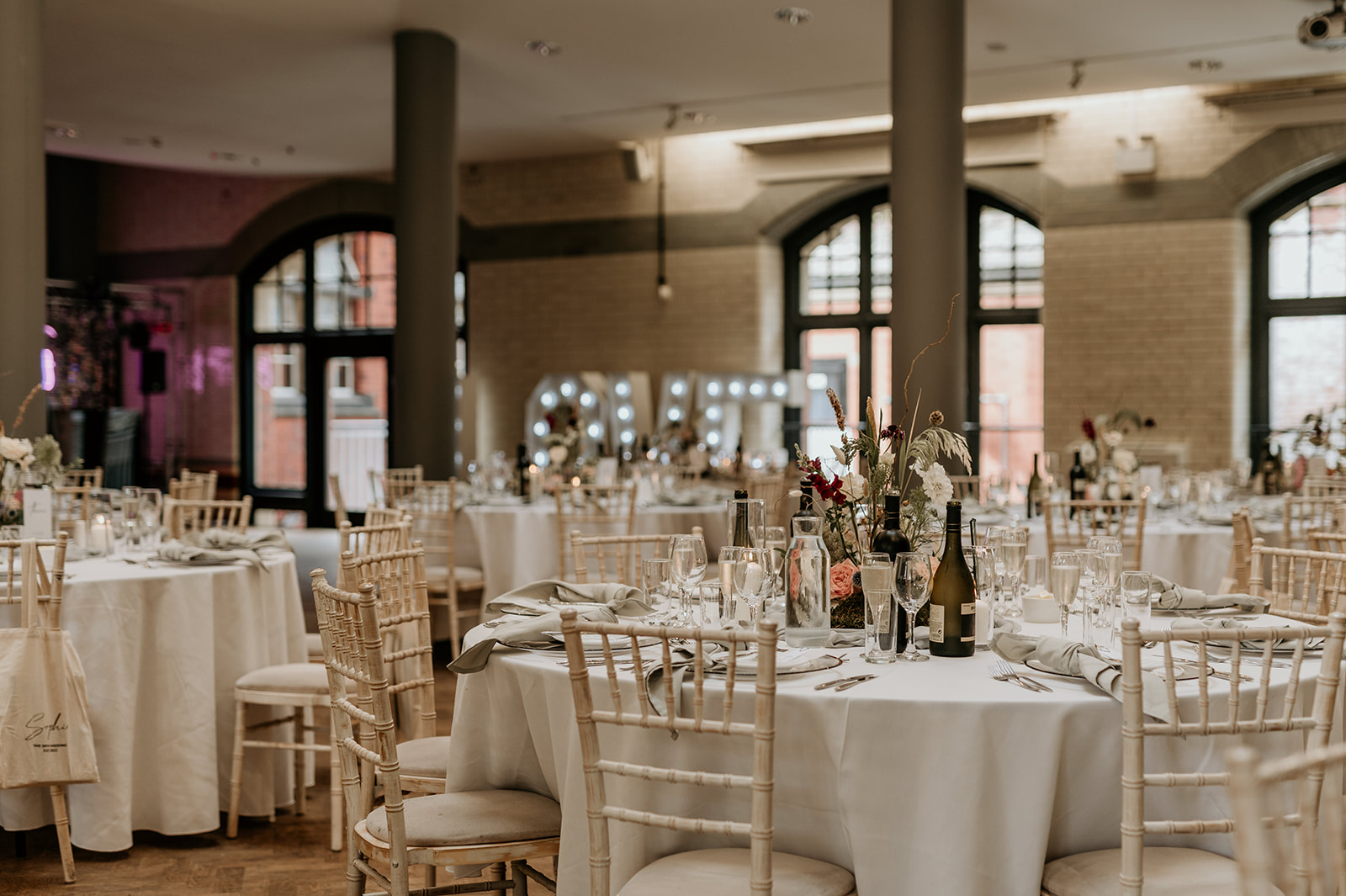 Elegant banquet hall with round tables, ideal for weddings and formal events.