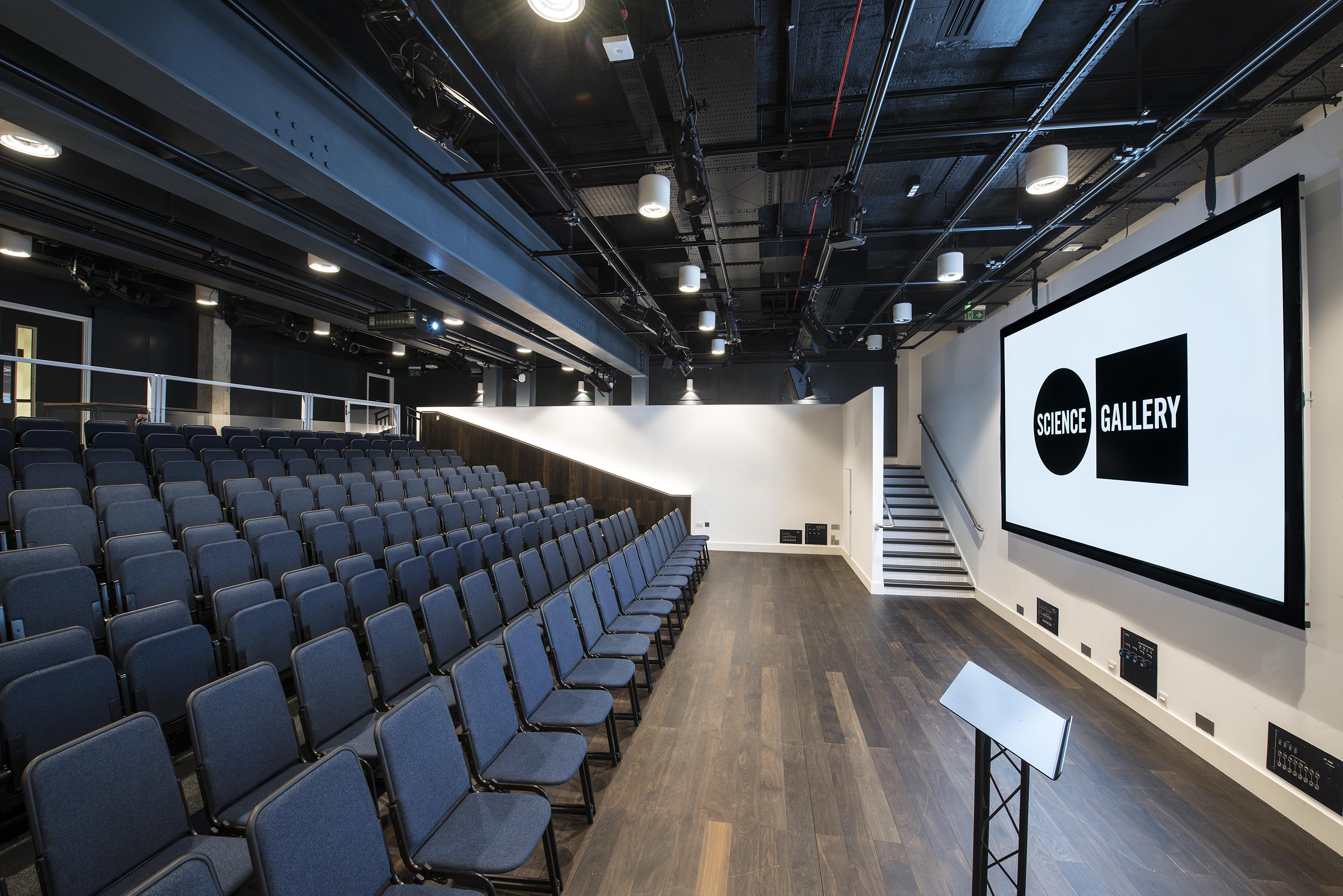 Modern event space in Science Gallery London with tiered seating for conferences and workshops.