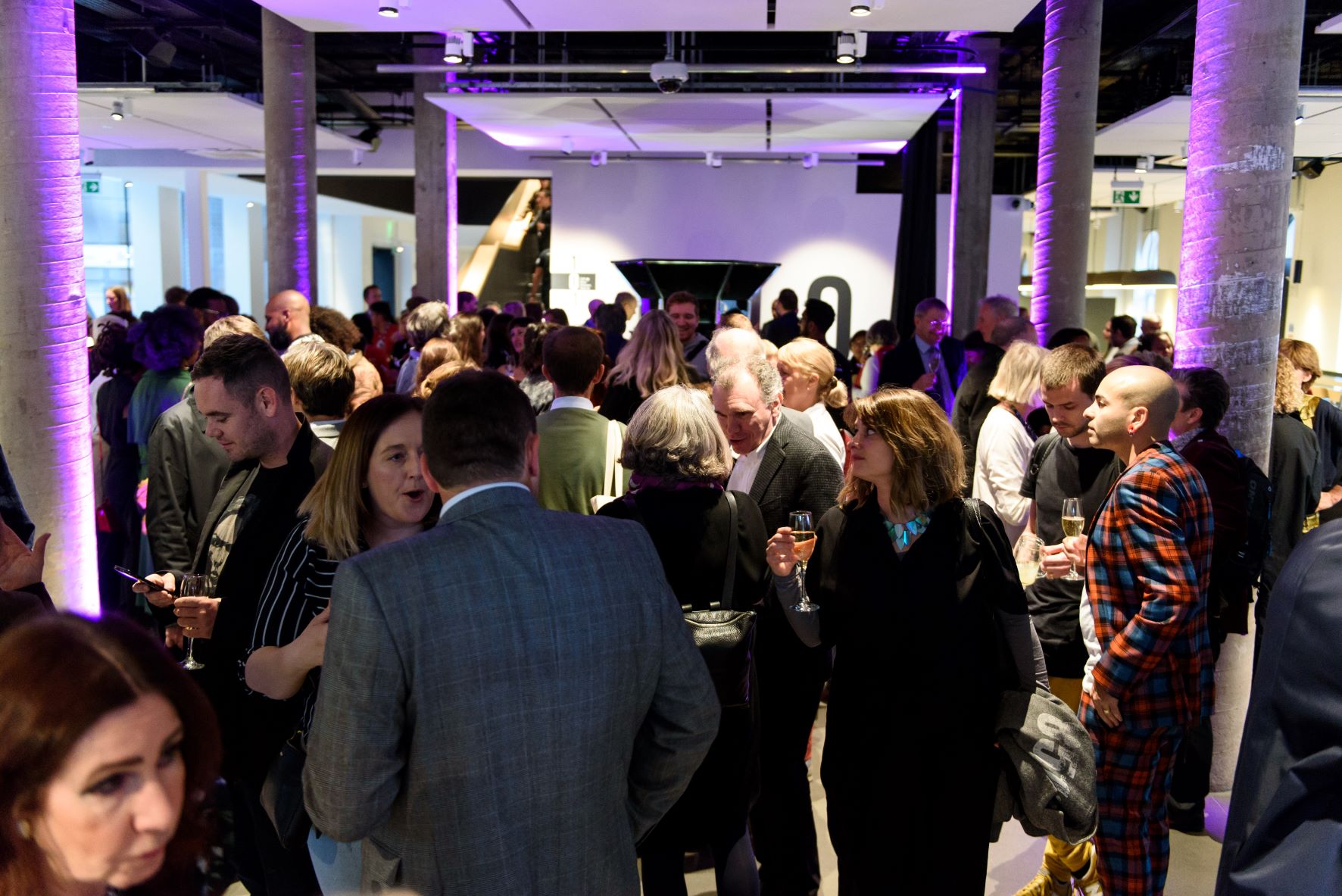 Vibrant networking event in modern Science Gallery London with stylish decor.