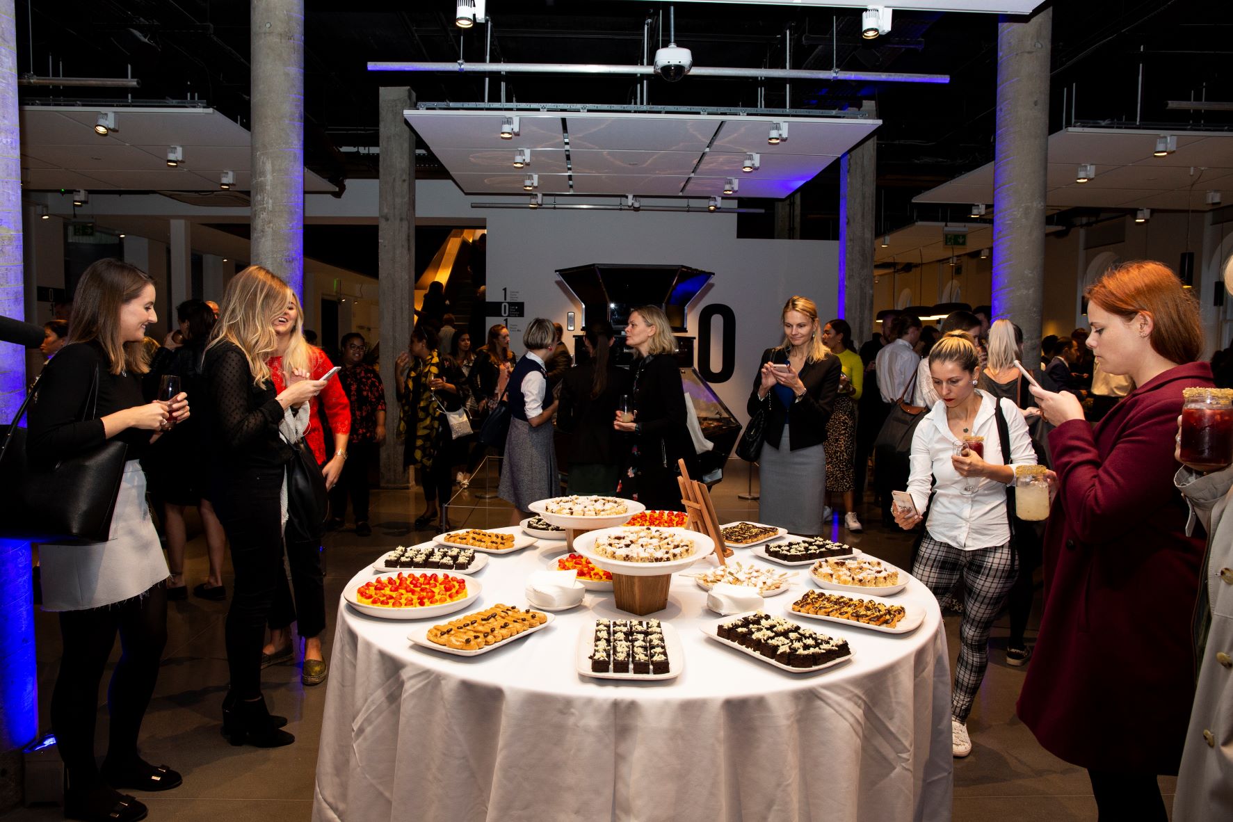 Vibrant networking event in Science Gallery London with elegant food display and modern ambiance.