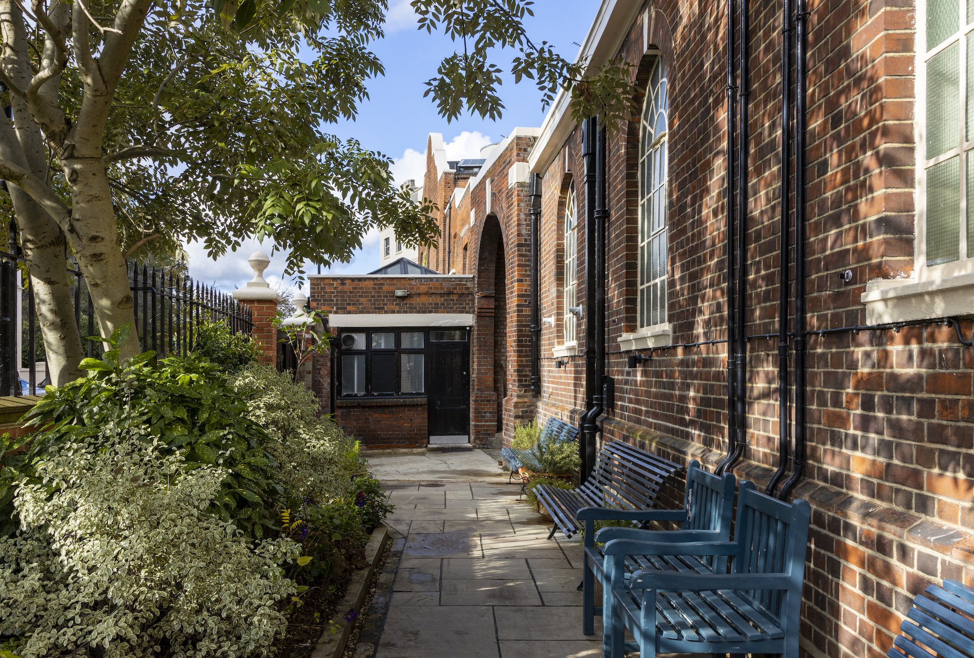 Charming outdoor venue with brick architecture for networking events in Park Village.