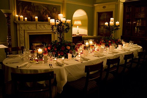 Elegant dining table with candlelight for a formal gala or dinner event.