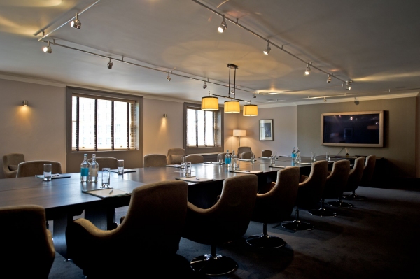 Boardroom at Home House with large conference table, ideal for meetings and presentations.