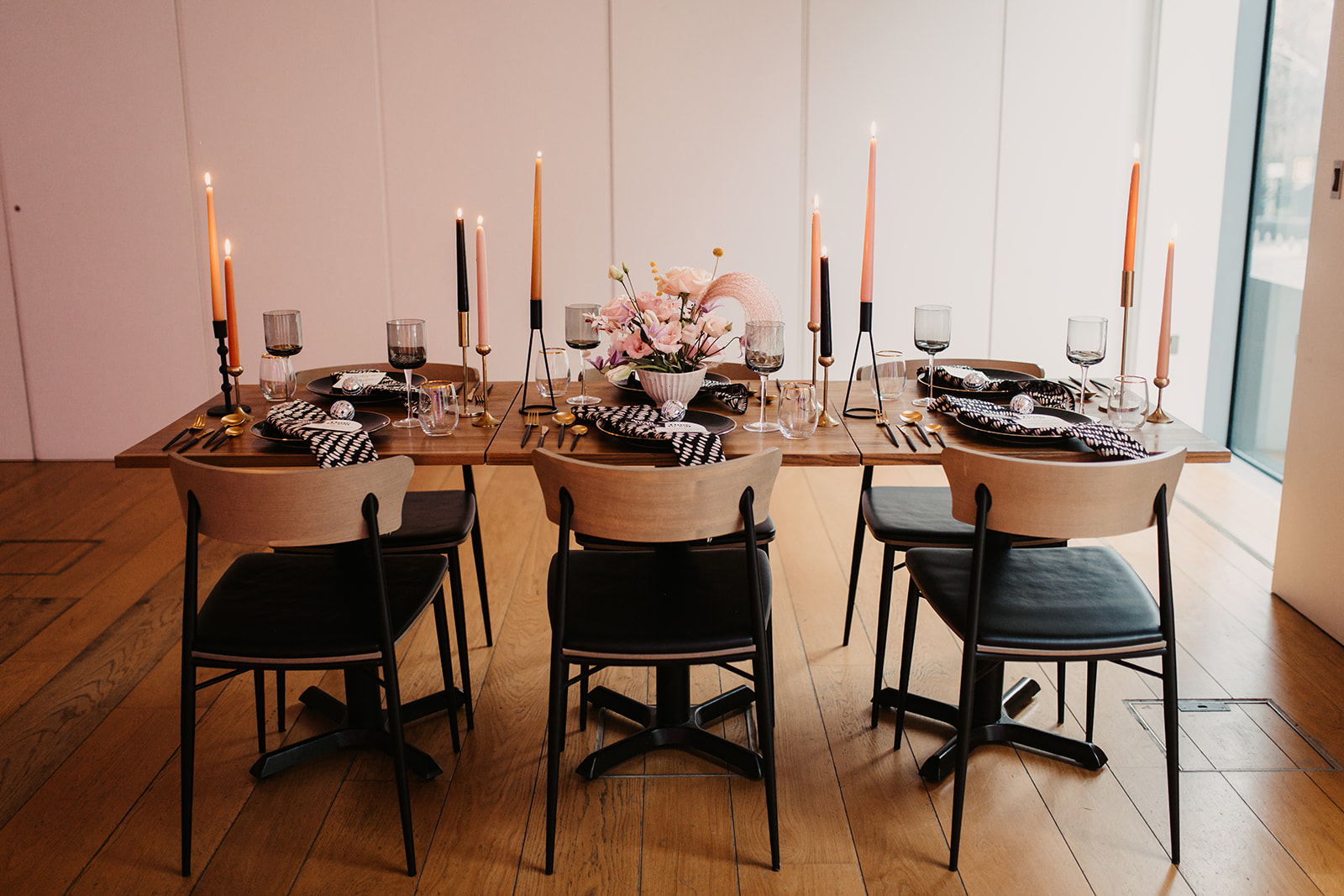 Elegant dining table setup with candles for intimate events at The Goldsmiths' Centre.