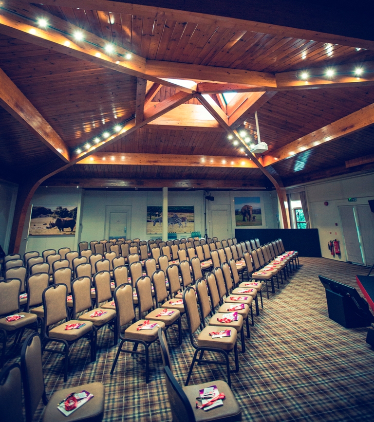 Meeting space at Woburn Safari Lodge with wooden beams, perfect for workshops and presentations.