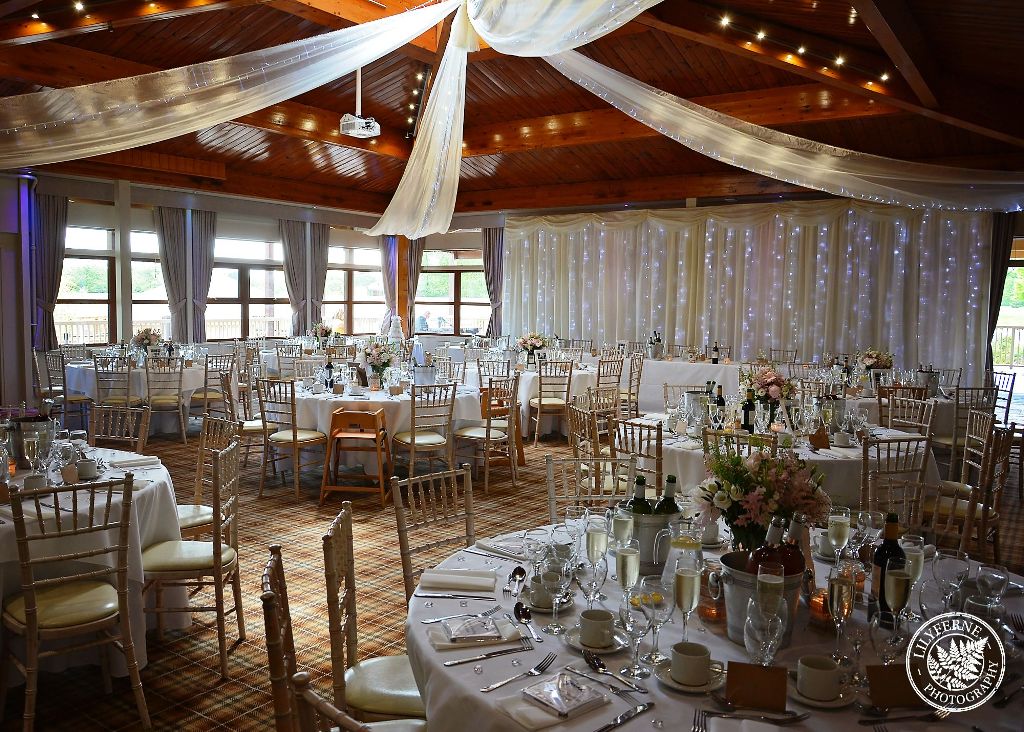 Elegant wedding event space at Woburn Safari Lodge with floral centerpieces.