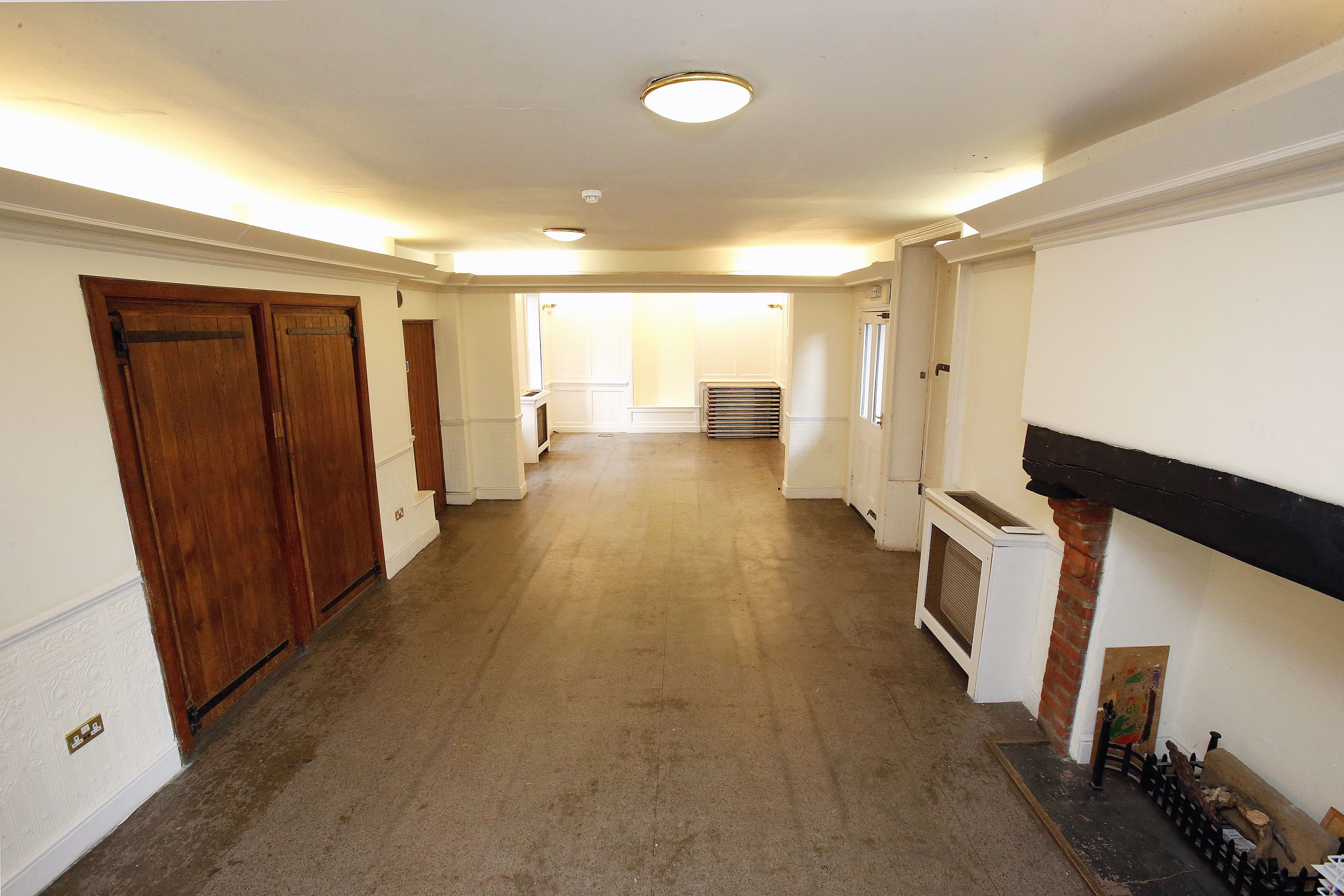 Ground Floor Salisbury Room: versatile event space with natural light and cozy fireplace.