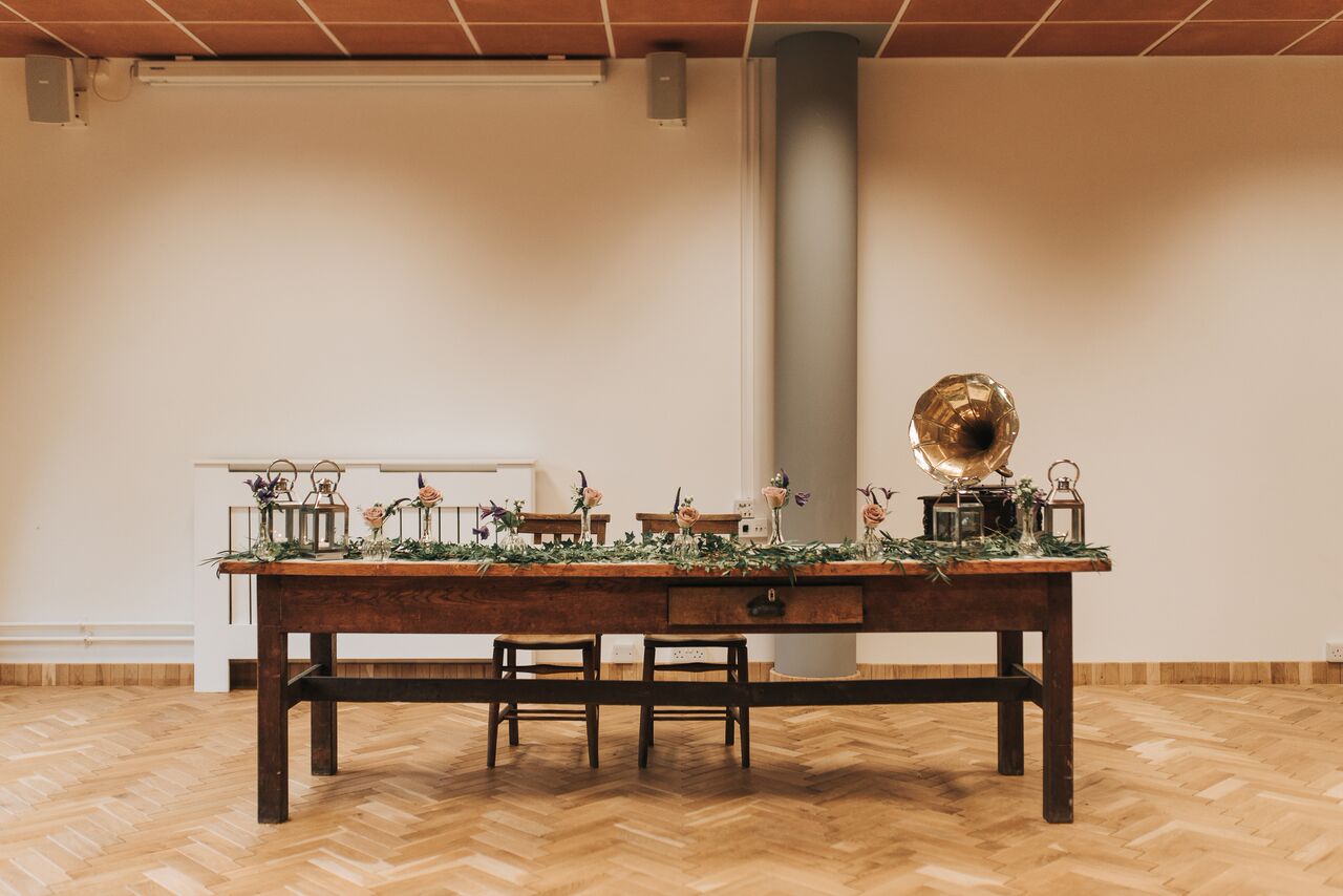 Intimate gathering table in The Ollerton Room, vintage decor for events and celebrations.